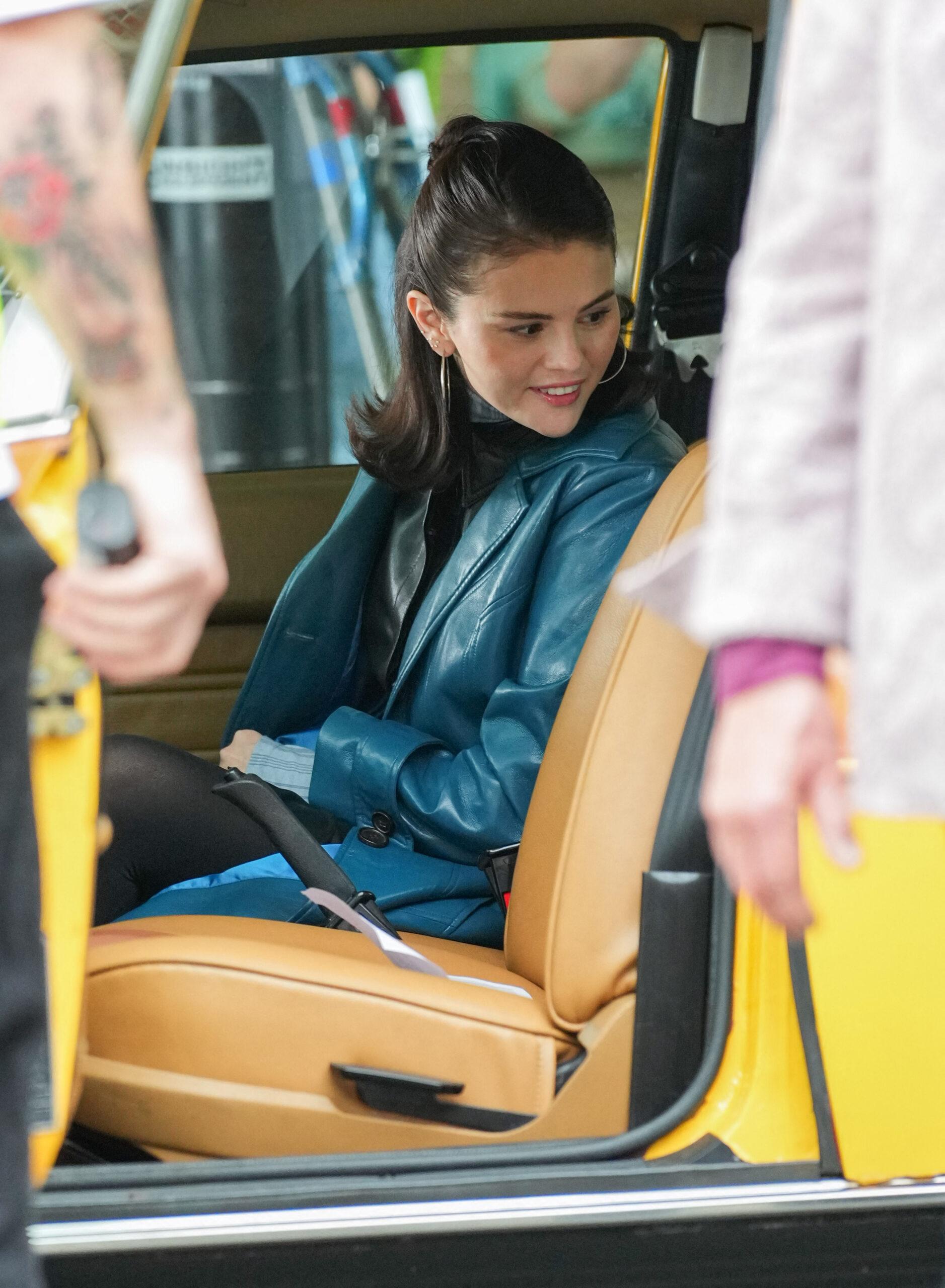 Selena Gomez sitting in a cab