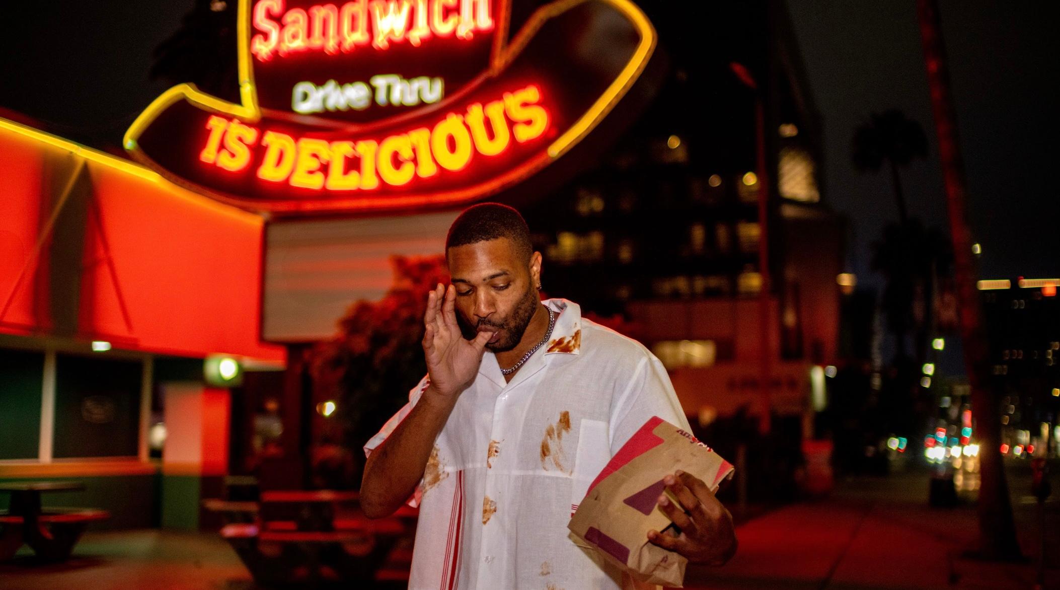 Man eating Arby's sandwich