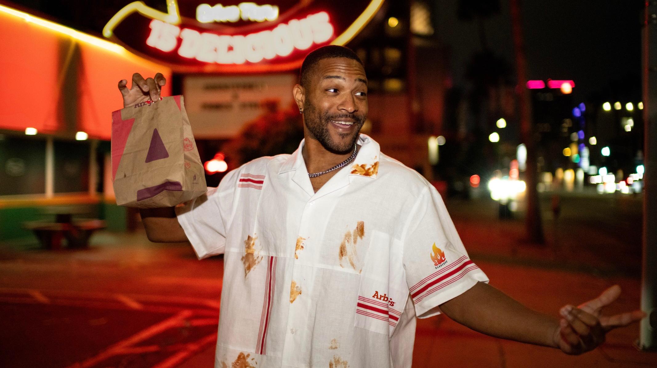 Man holding Arby's sandwich