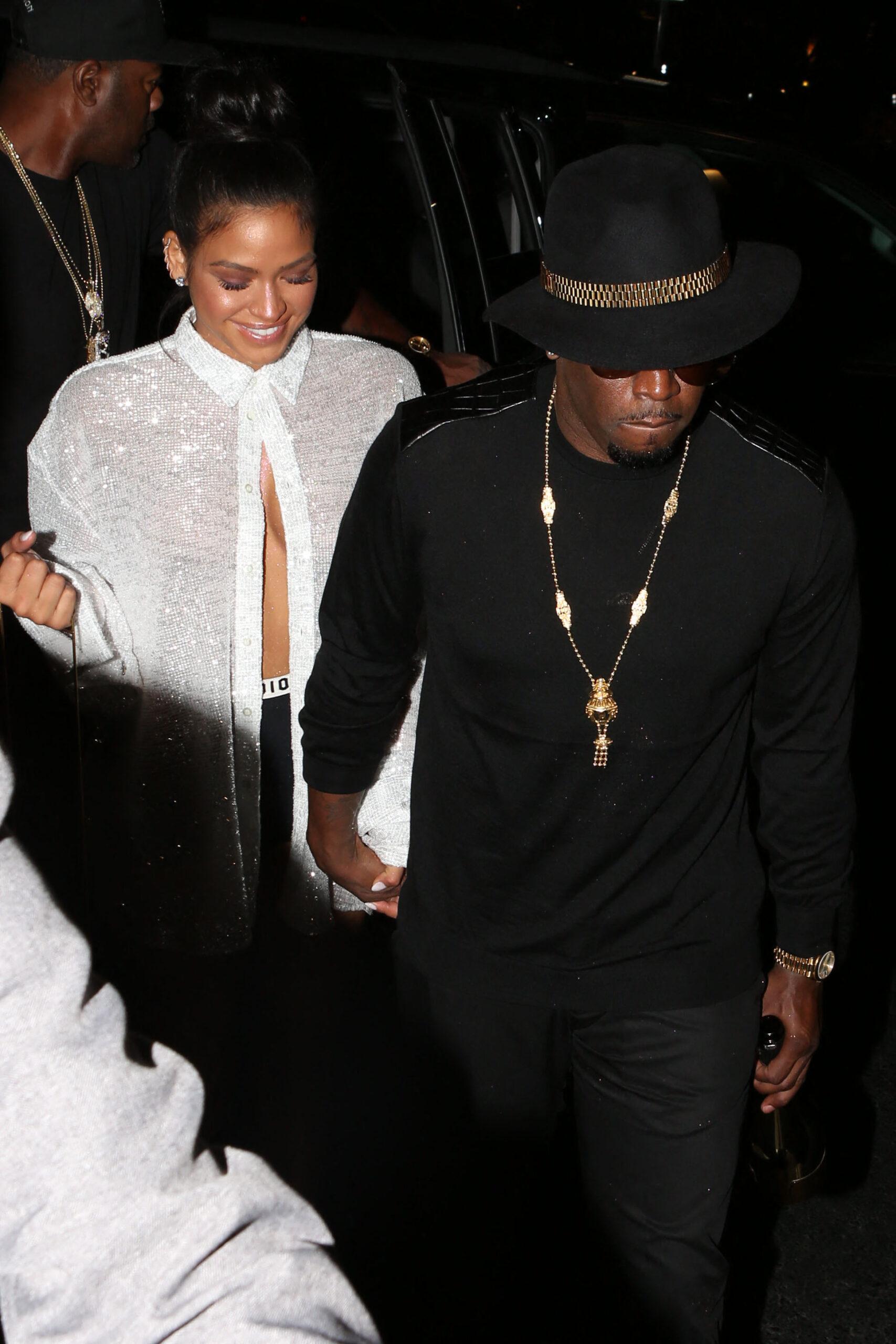 Diddy and Cassie arrive at McGregor Vs Mayweather holding a bottle of champagne