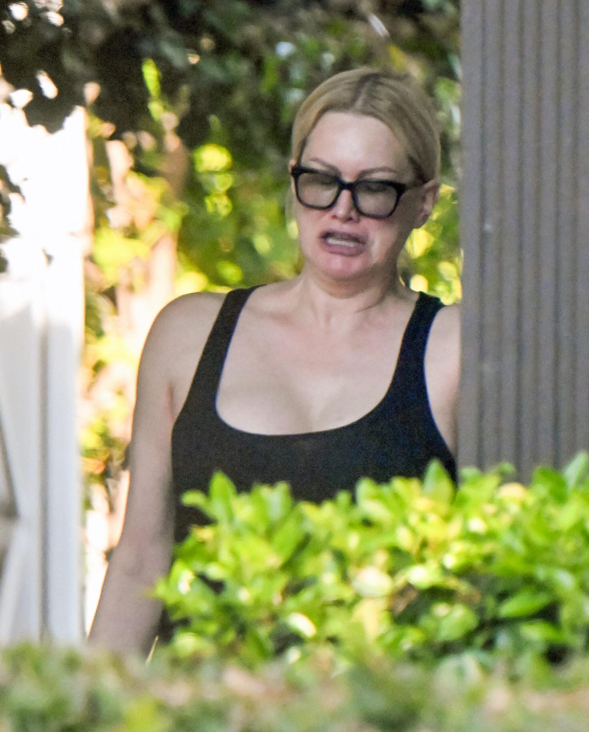 Alice Evans steps out to grab food delivery at her LA home amid claims she has no month for food, bills or rent.