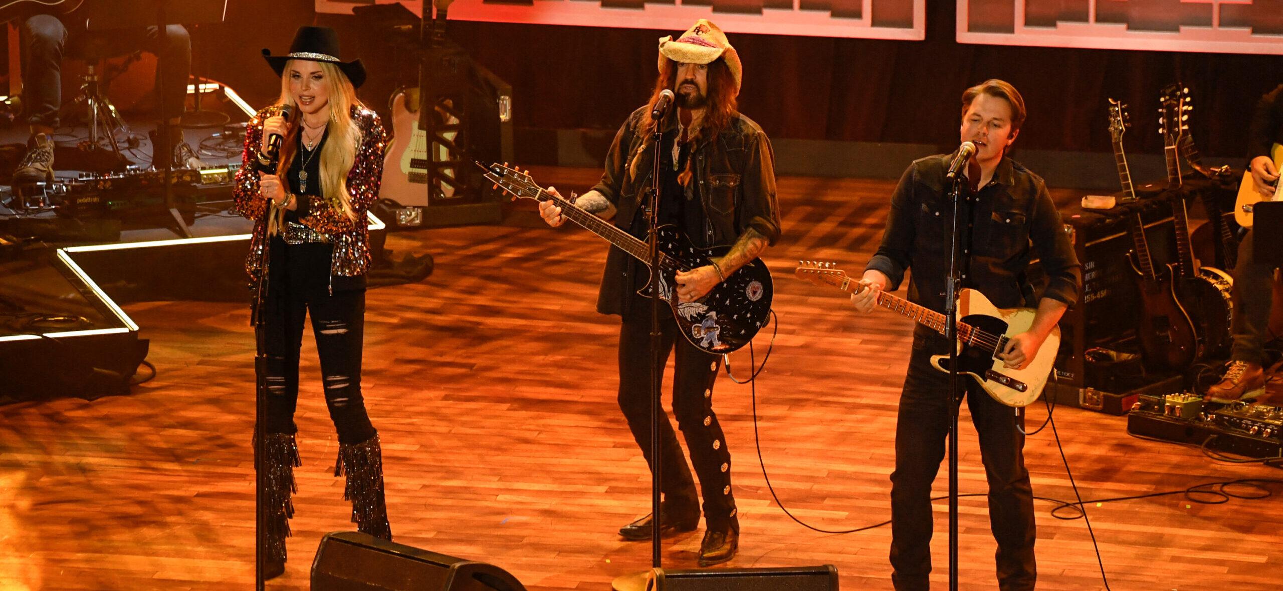 FIREROSE, Billy Ray Cyrus and Travis Denning performing on stage