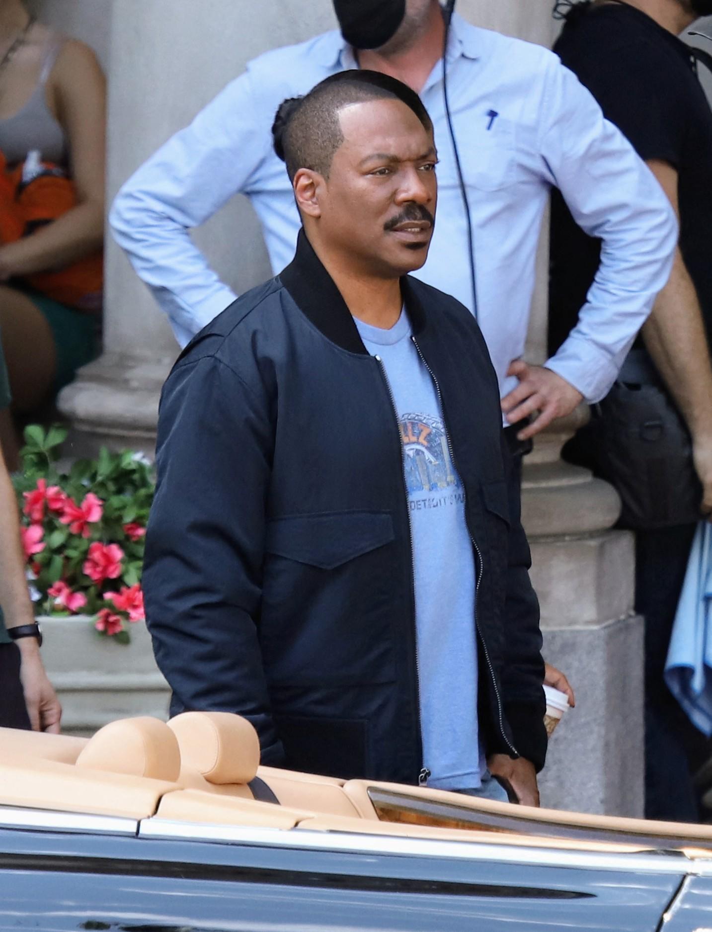 Eddie Murphy and cast shoot scenes for Beverly Hills Cop in "Axle F" film set