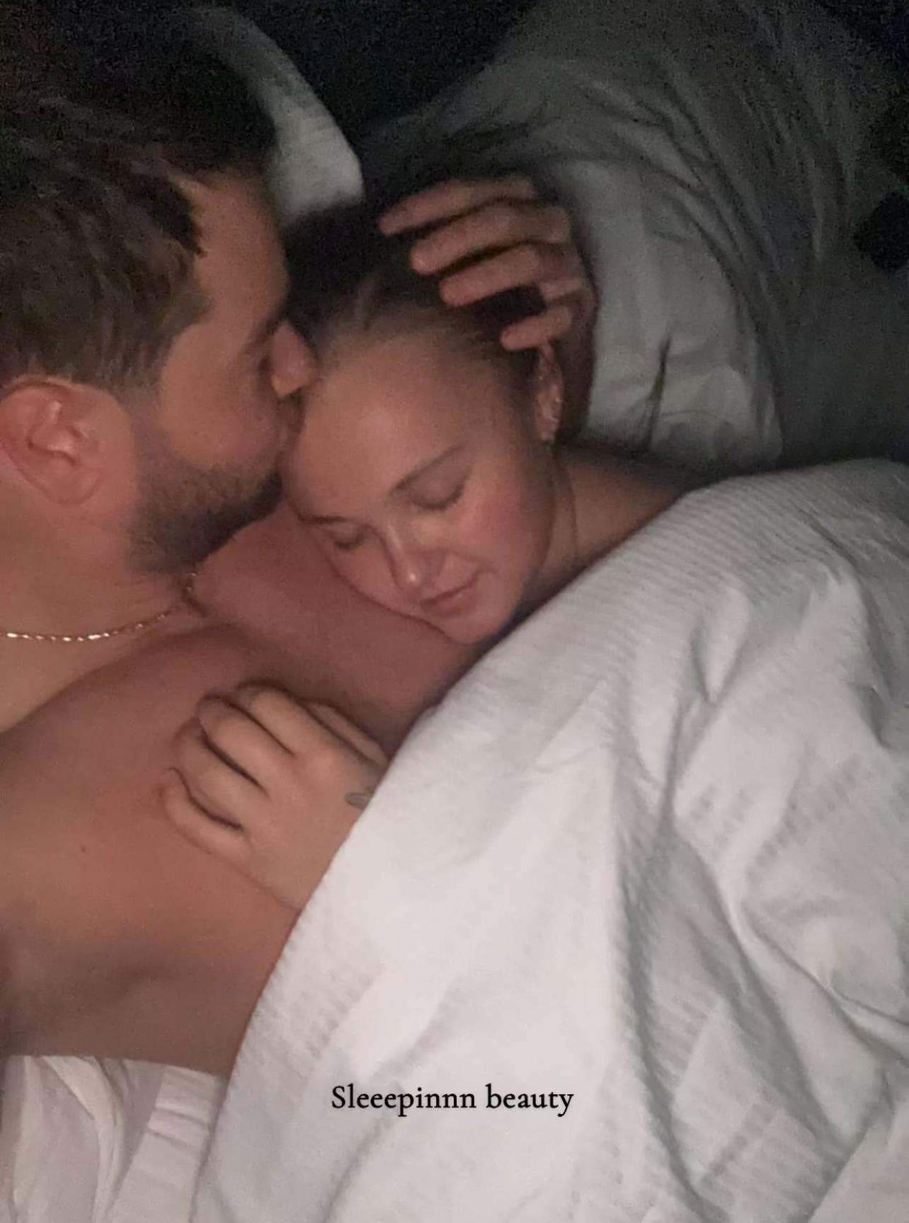 A photo of Chris Hughes cuddling with JoJo Siwa