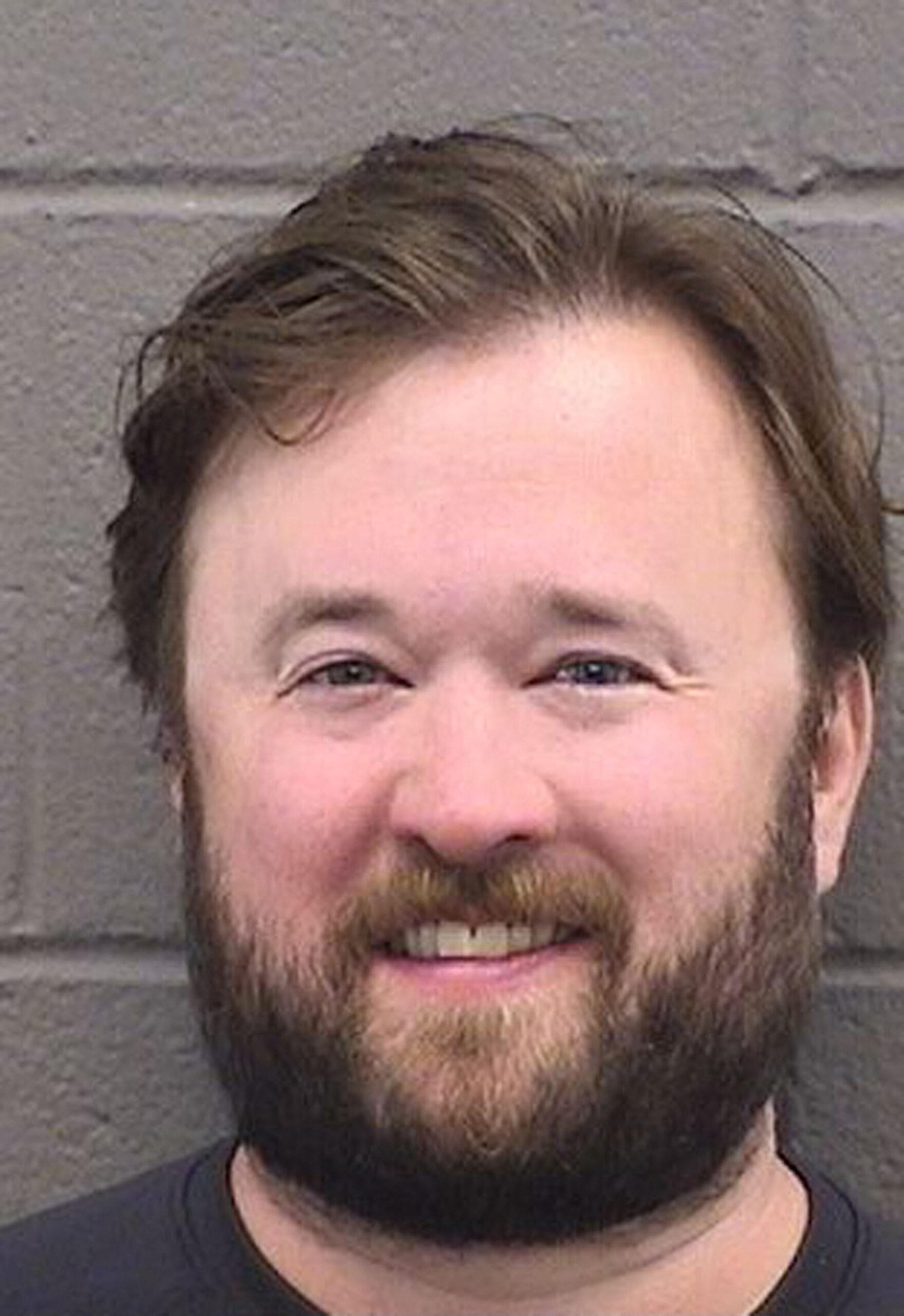 Haley Joel Osment smiles in police mugshot after arrest for public intoxication at ski resort