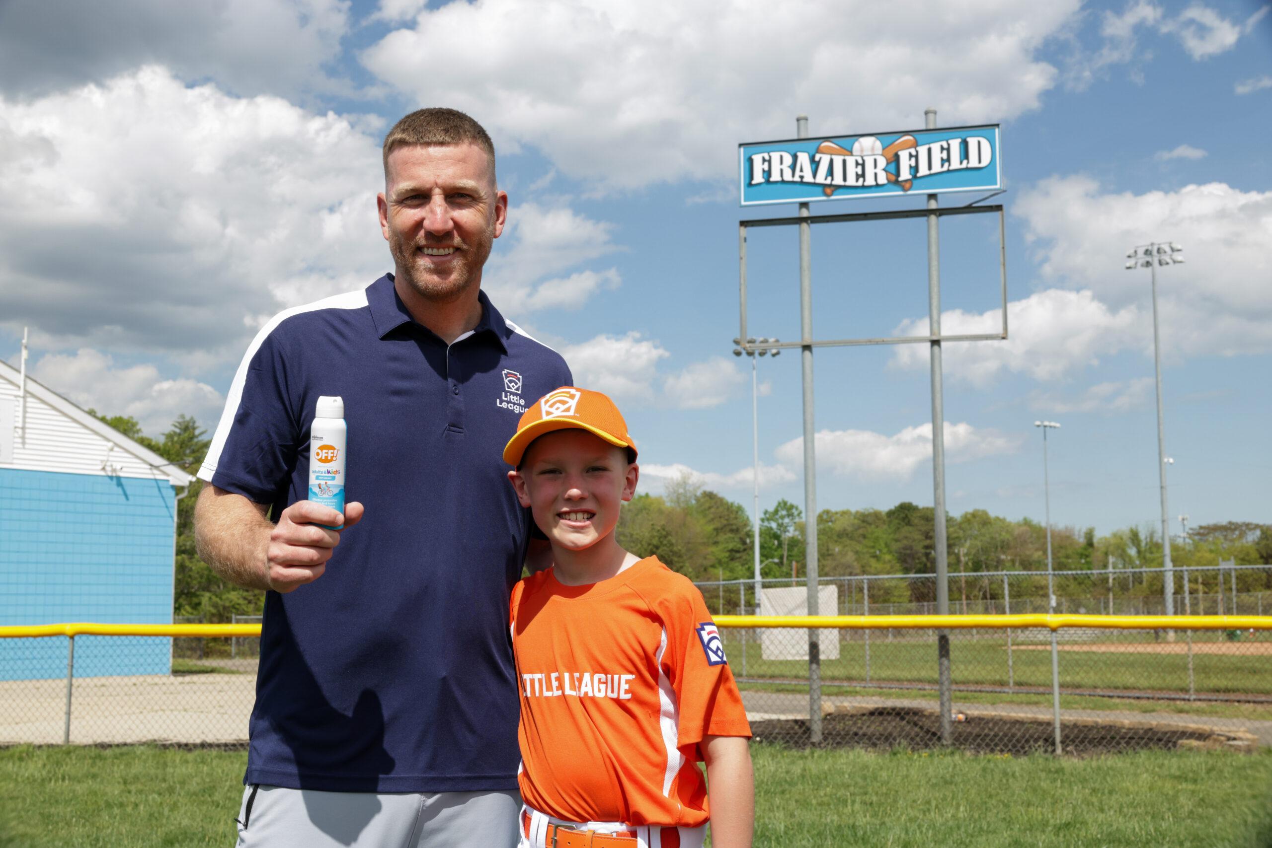 Todd Frazier holding OFF! next to kid