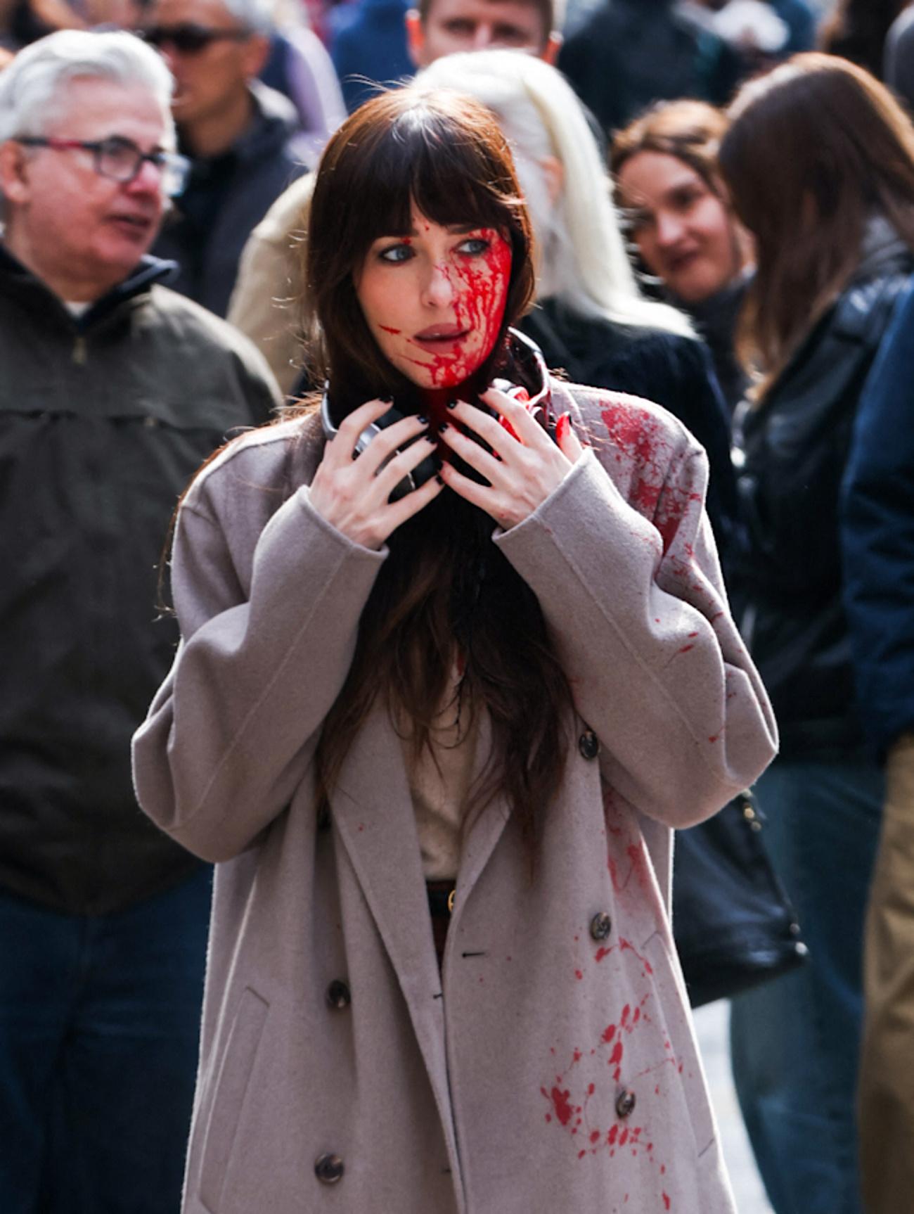 Dakota Johnson is seen with blood all over her face as she films scenes with Josh Harnett for their new movie Verity this afternoon in New York City