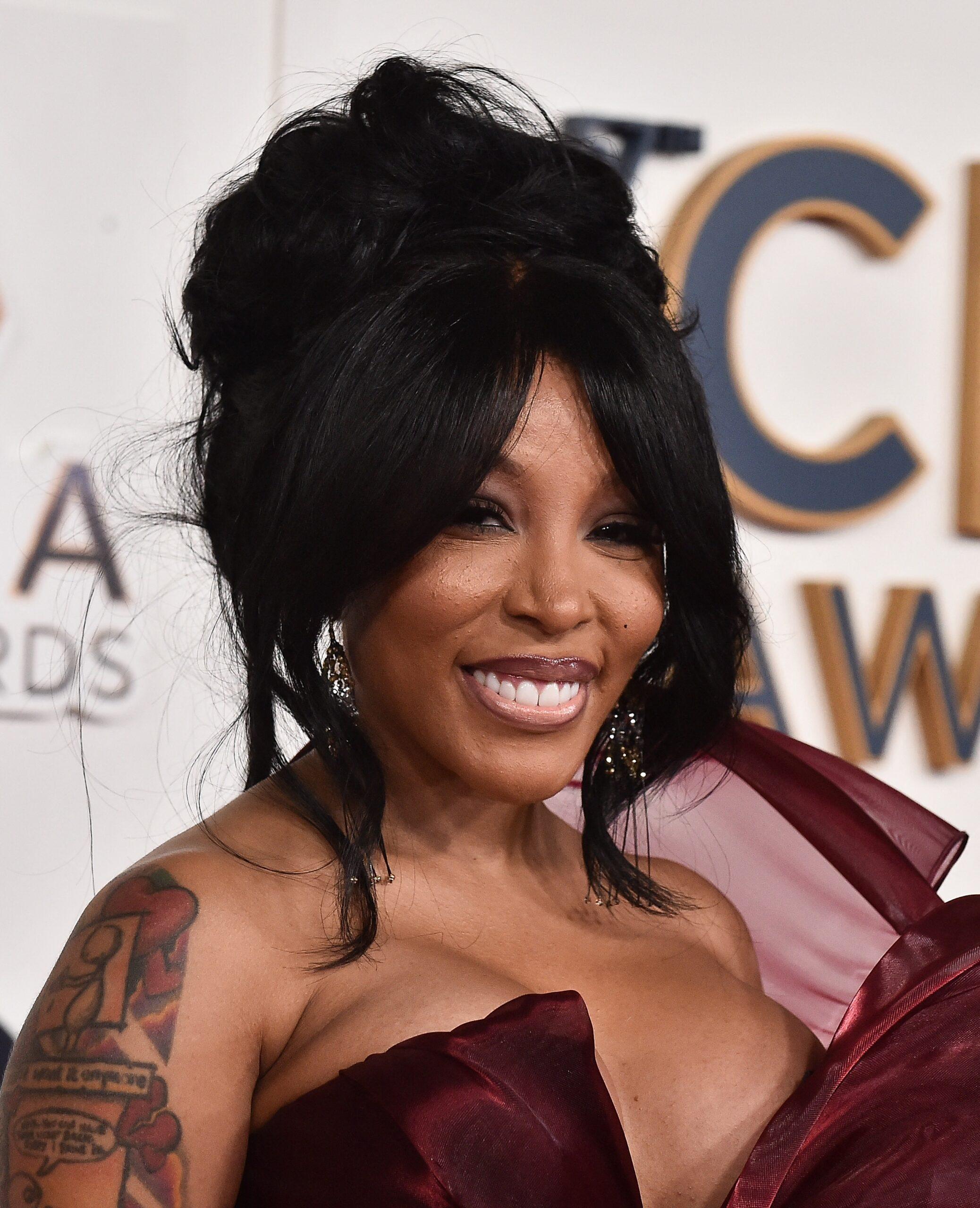 K. Michelle posing on the CMA red carpet. 