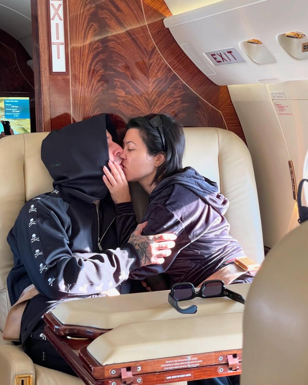 Kourtney Kardashian and Travis Barker kissing