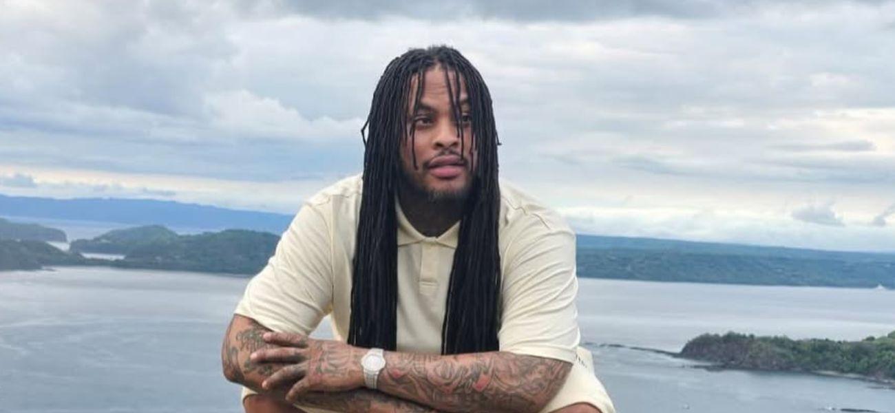 Waka Flocka Flame kneeling down