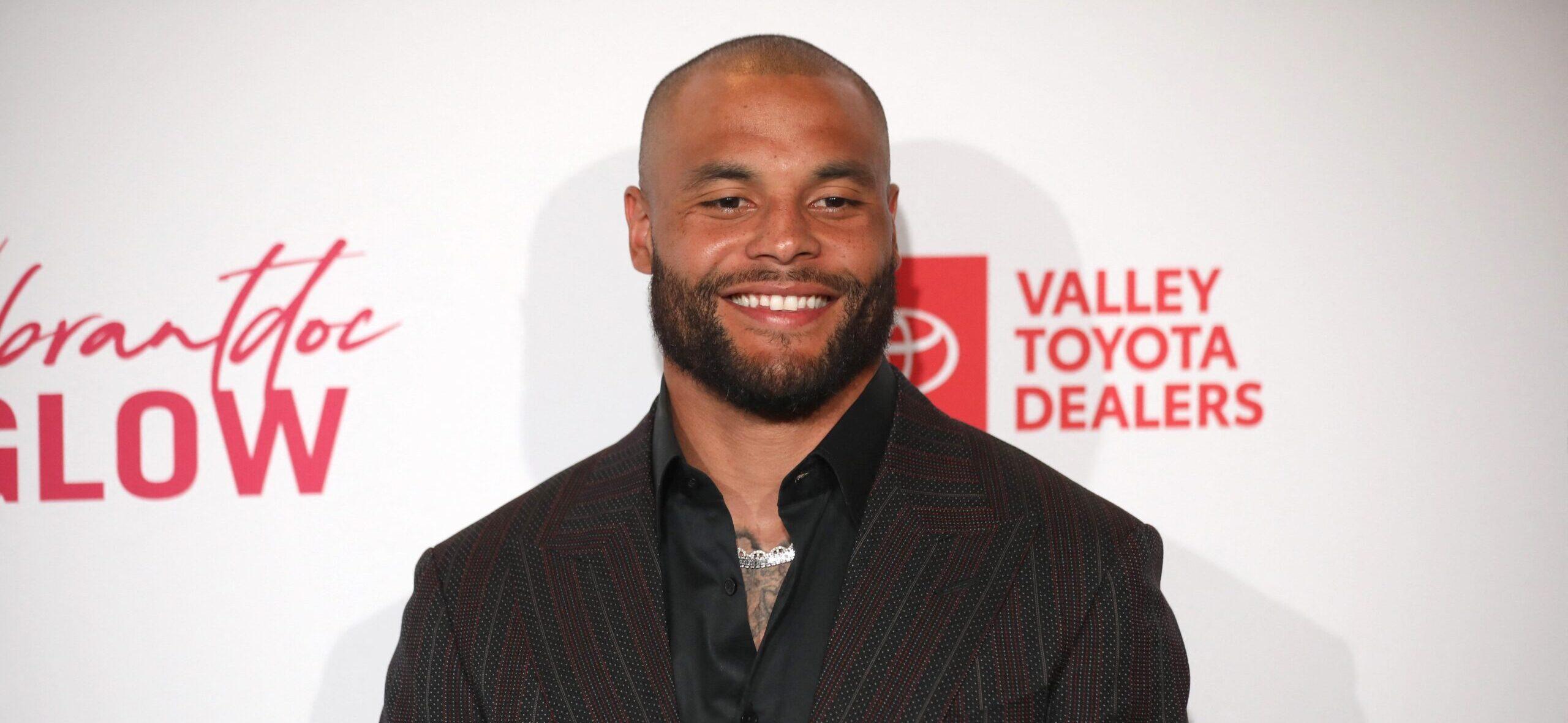 Dak Prescott posing on the red carpet.
