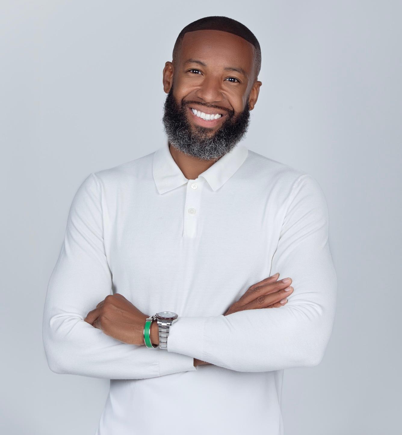 Carlos King in white shirt