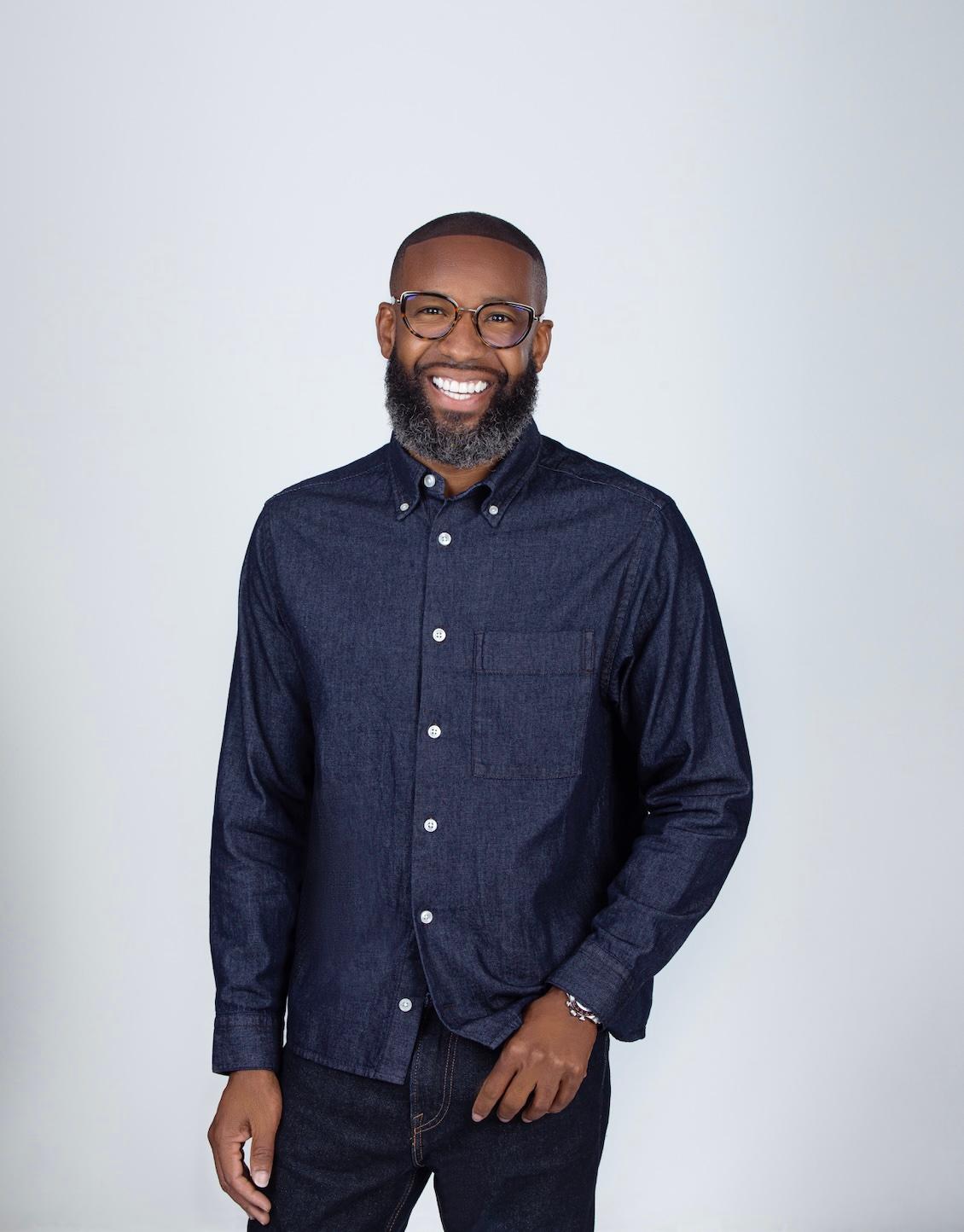 Carlos King wearing glasses