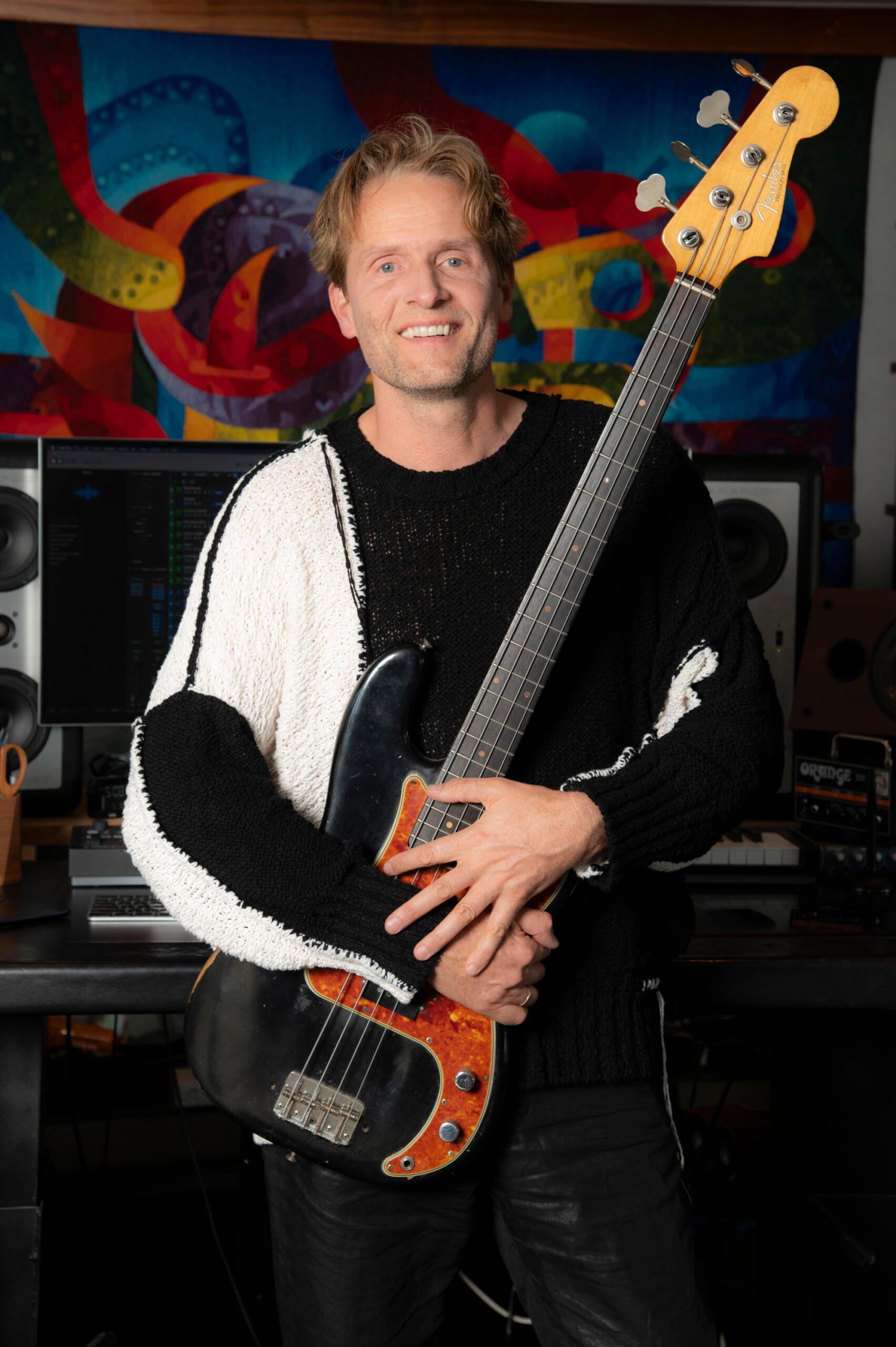 Toby Gad holding guitar