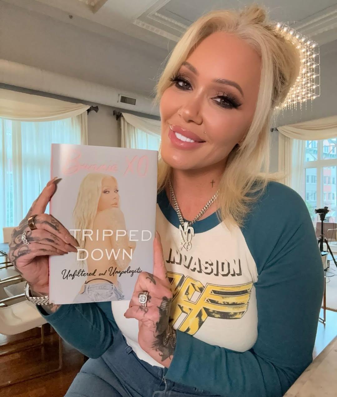 Bunnie XO holding her upcoming book