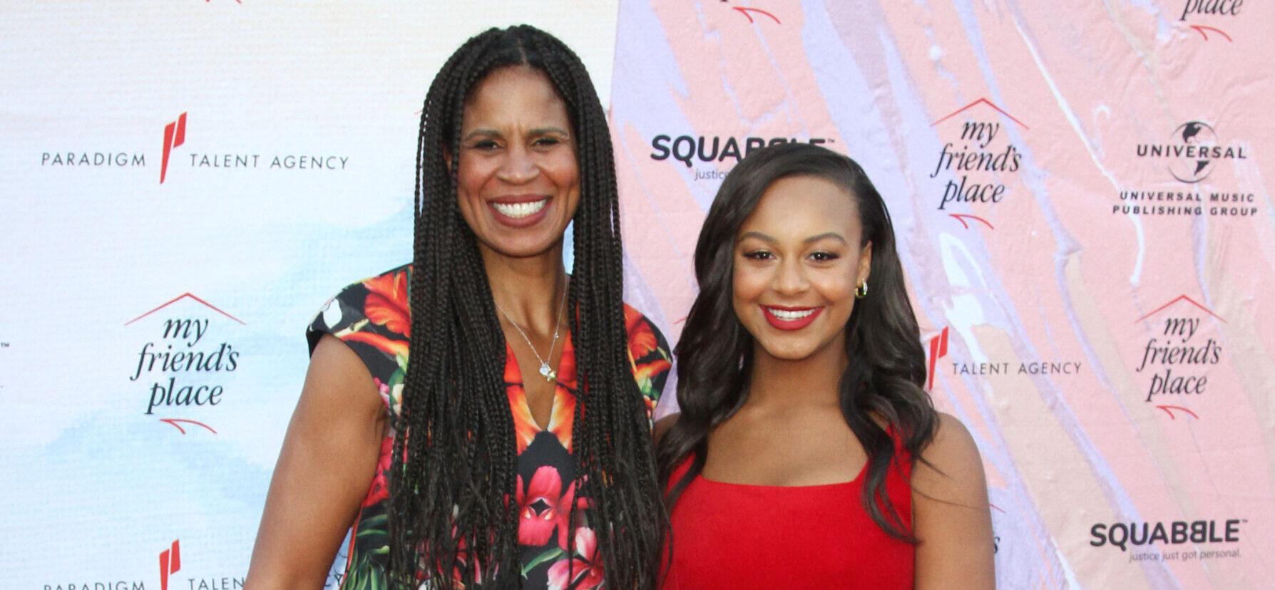 Nia Sioux posing with her mother, Dr. Holly Frazier, on the red carpet.
