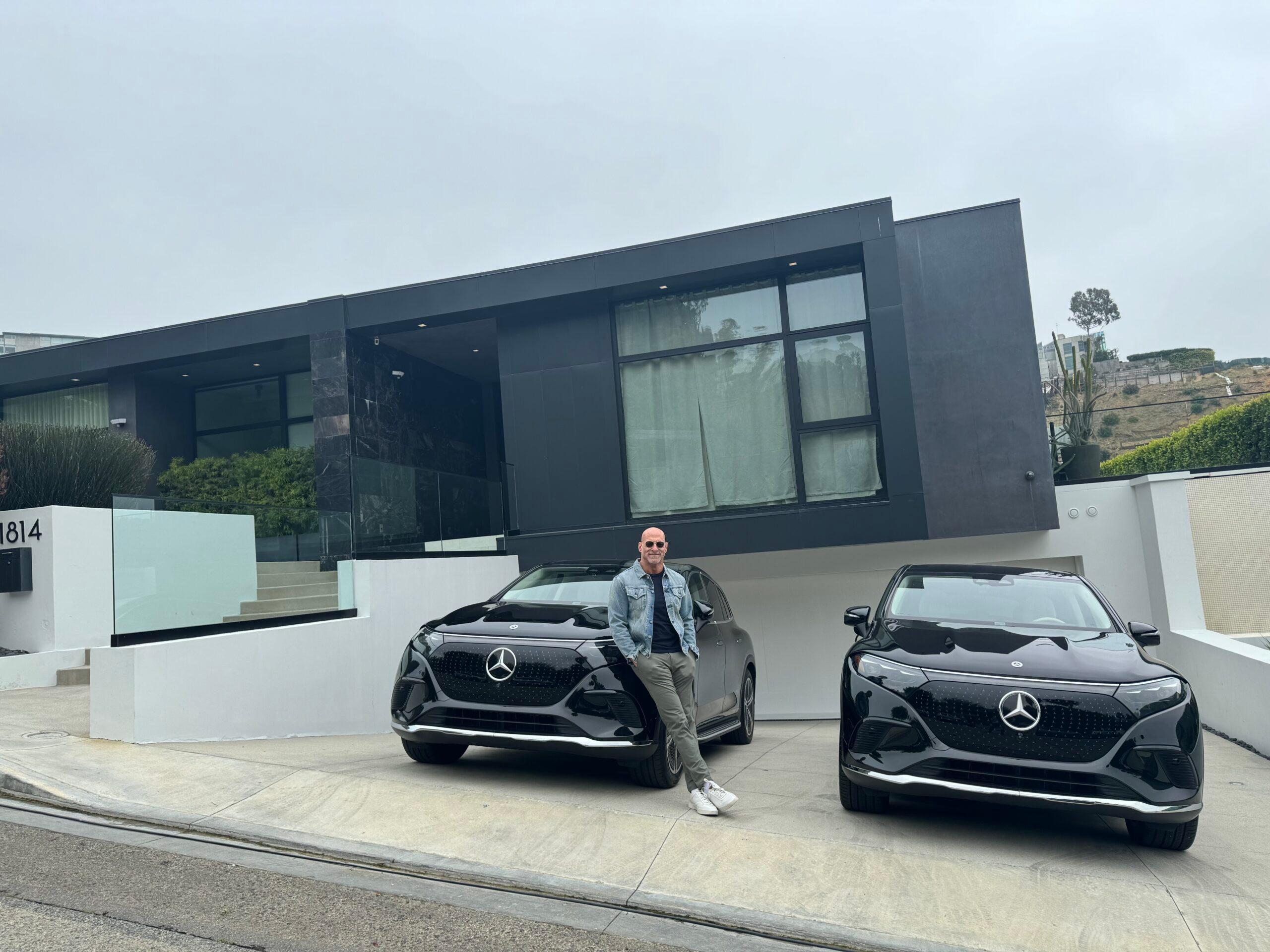Richard Taite leaning on a car
