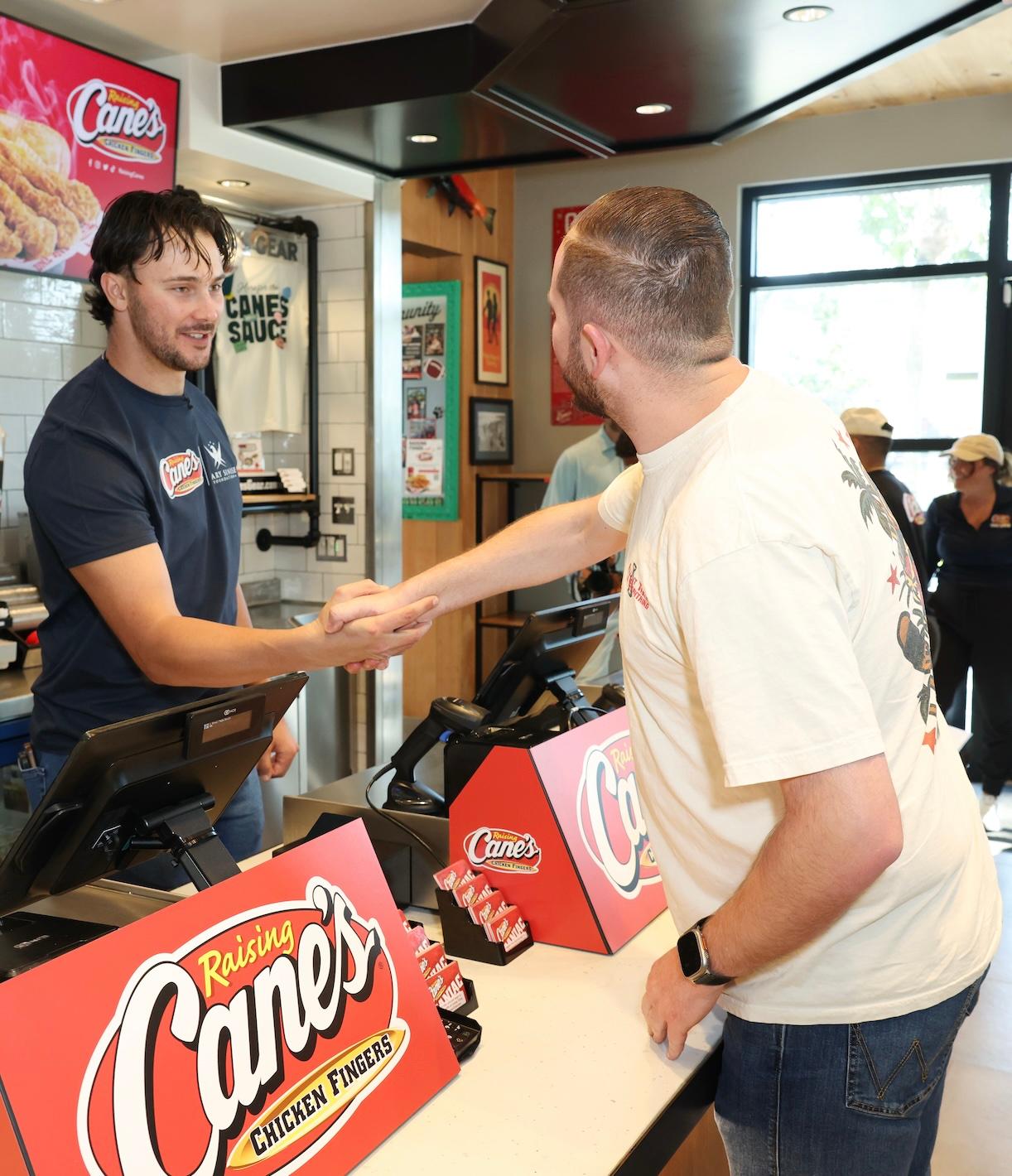 Paul Skenes serving veteran at Raising Cane's