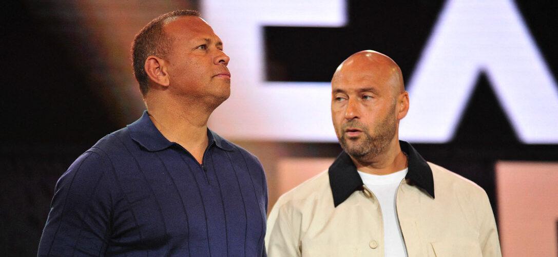Alex Rodriguez and Derek Jeter standing next to each in other in a photo.