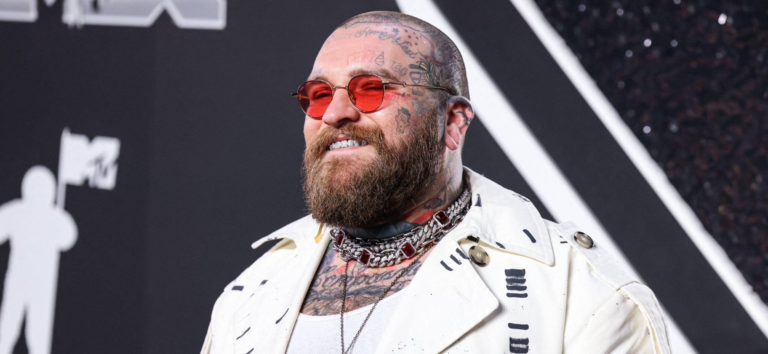 Teddy Swims posing on the red carpet.