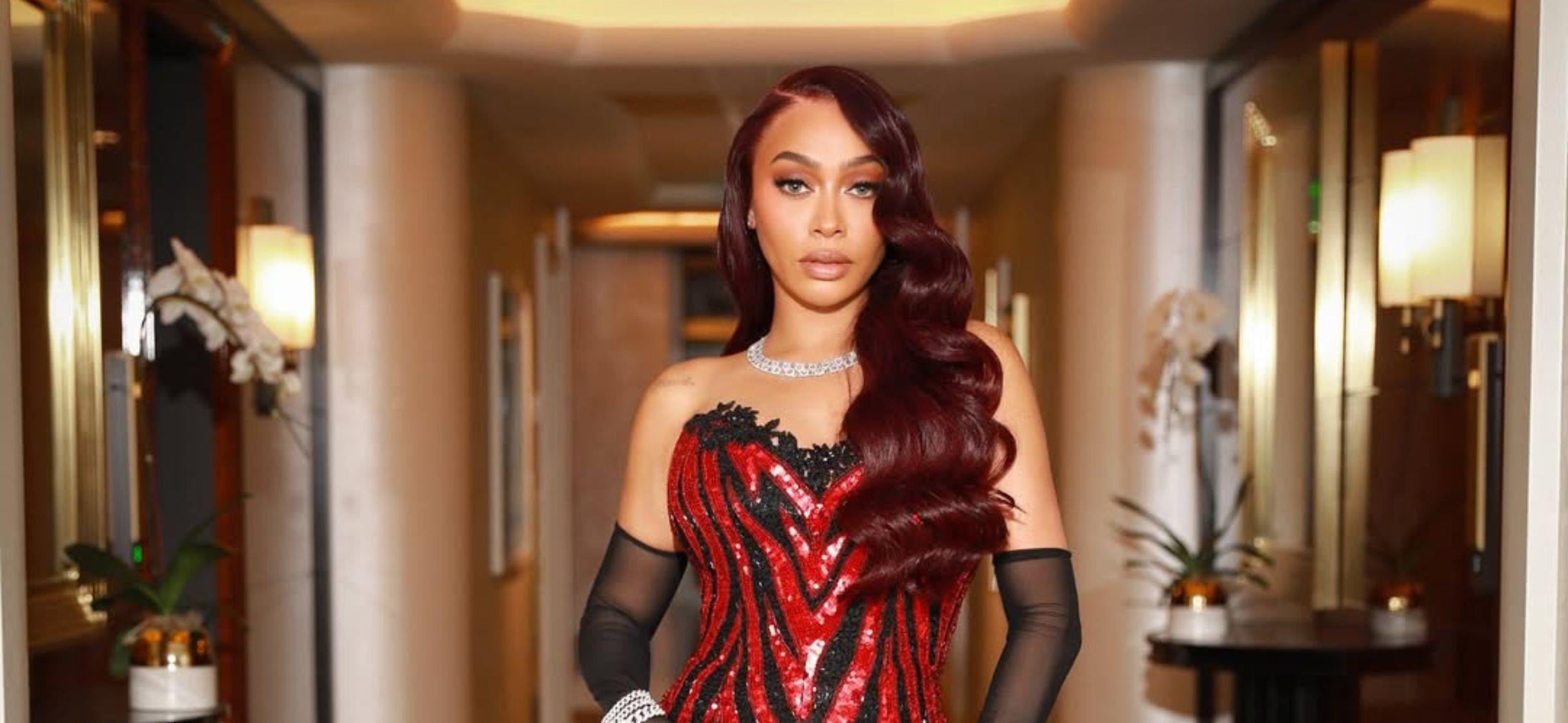 La La Anthony in a red dress