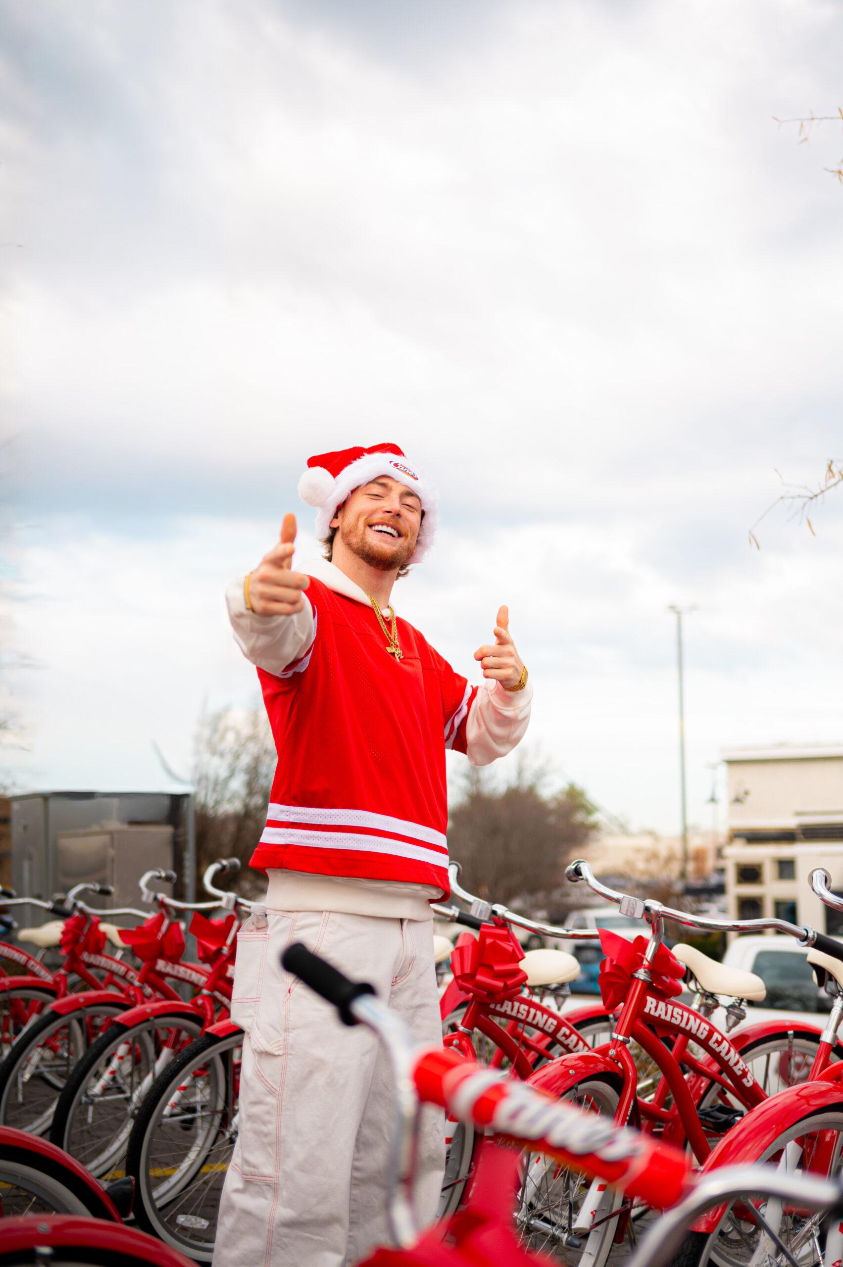 Bailey Zimmerman at Raising Cane's event for bike giveaway