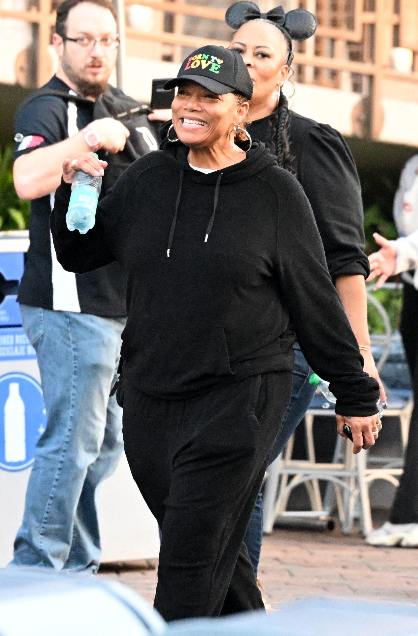 Queen Latifah shows off her dramatic weight loss as she and her longtime partner Eboni Nichols enjoy a day at Disneyland