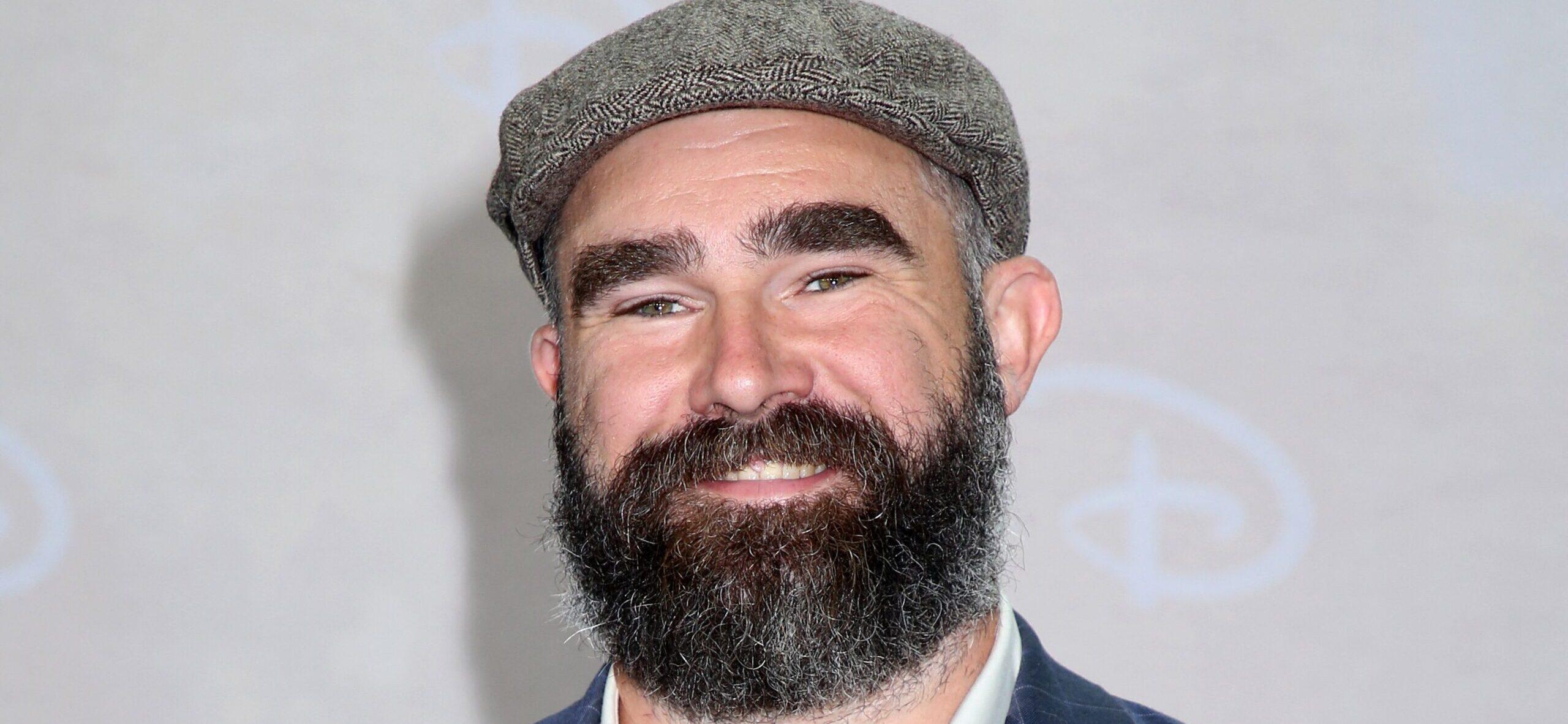 NFL star Jason Kelce posing on the red carpet.