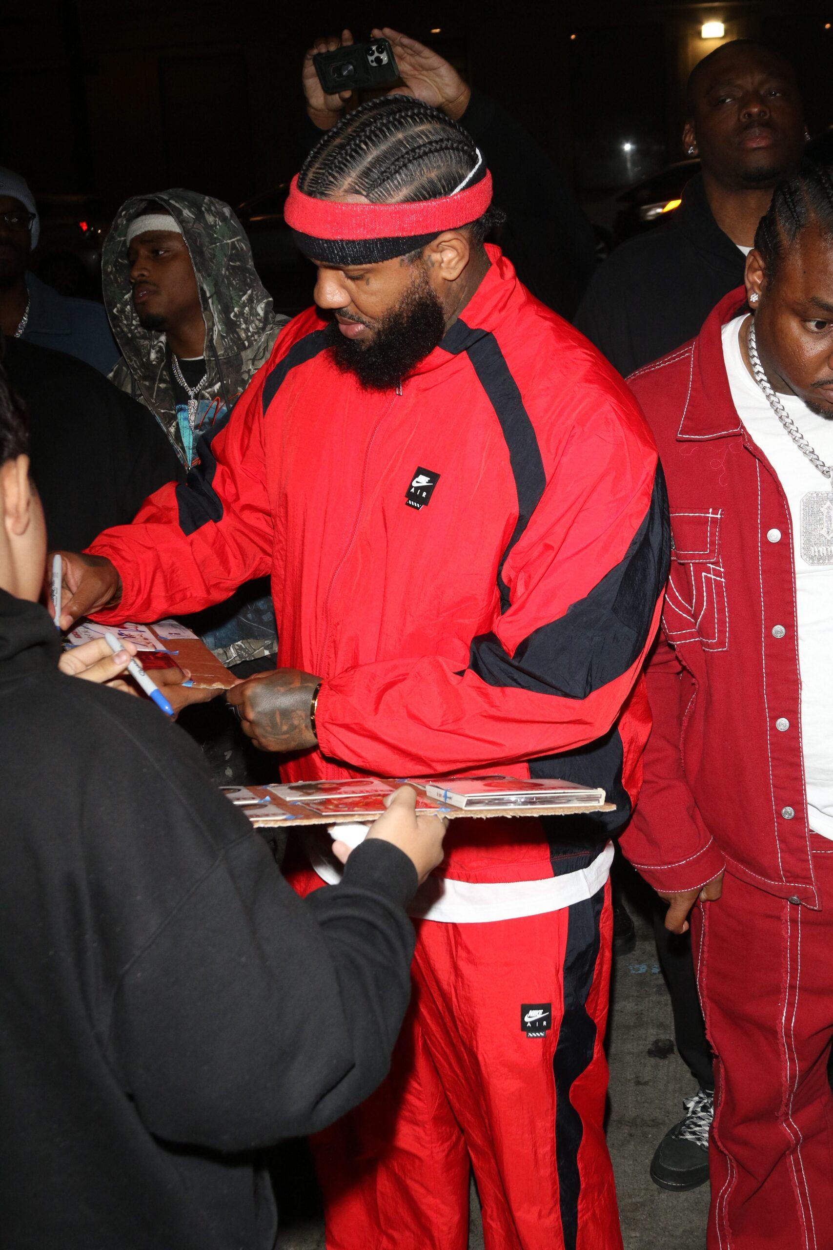 The Game signing autographs.