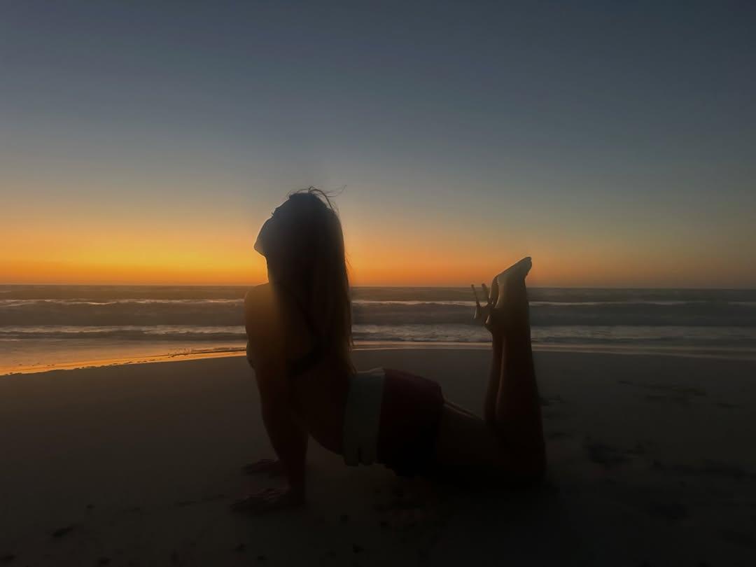 Addison Rae doing yoga in heels on the beach