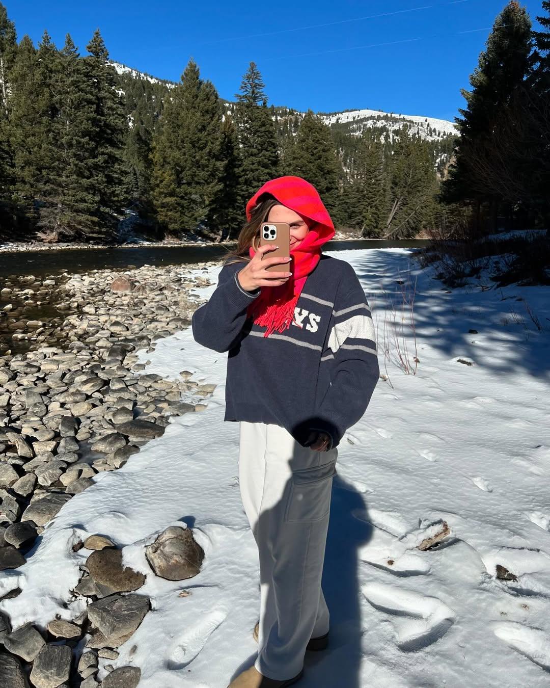 Nicole Faith takes a photo while in the snow