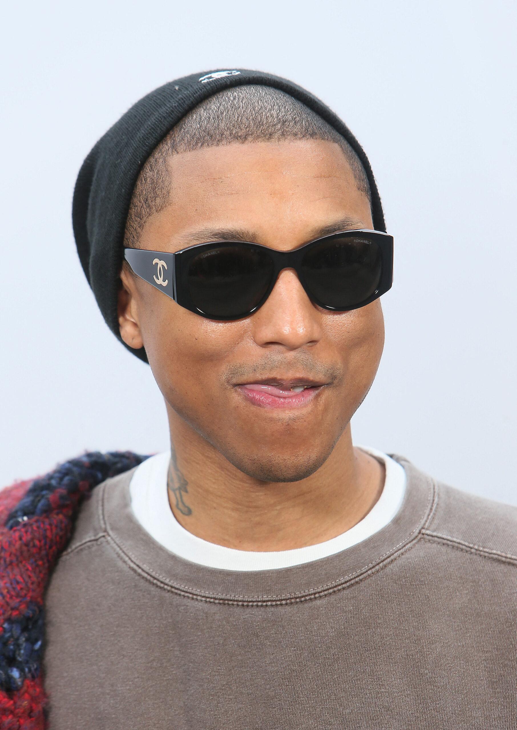 Pharrell Williams poses before Chanel's Fall-Winter 2017/2018 ready-to-wear fashion