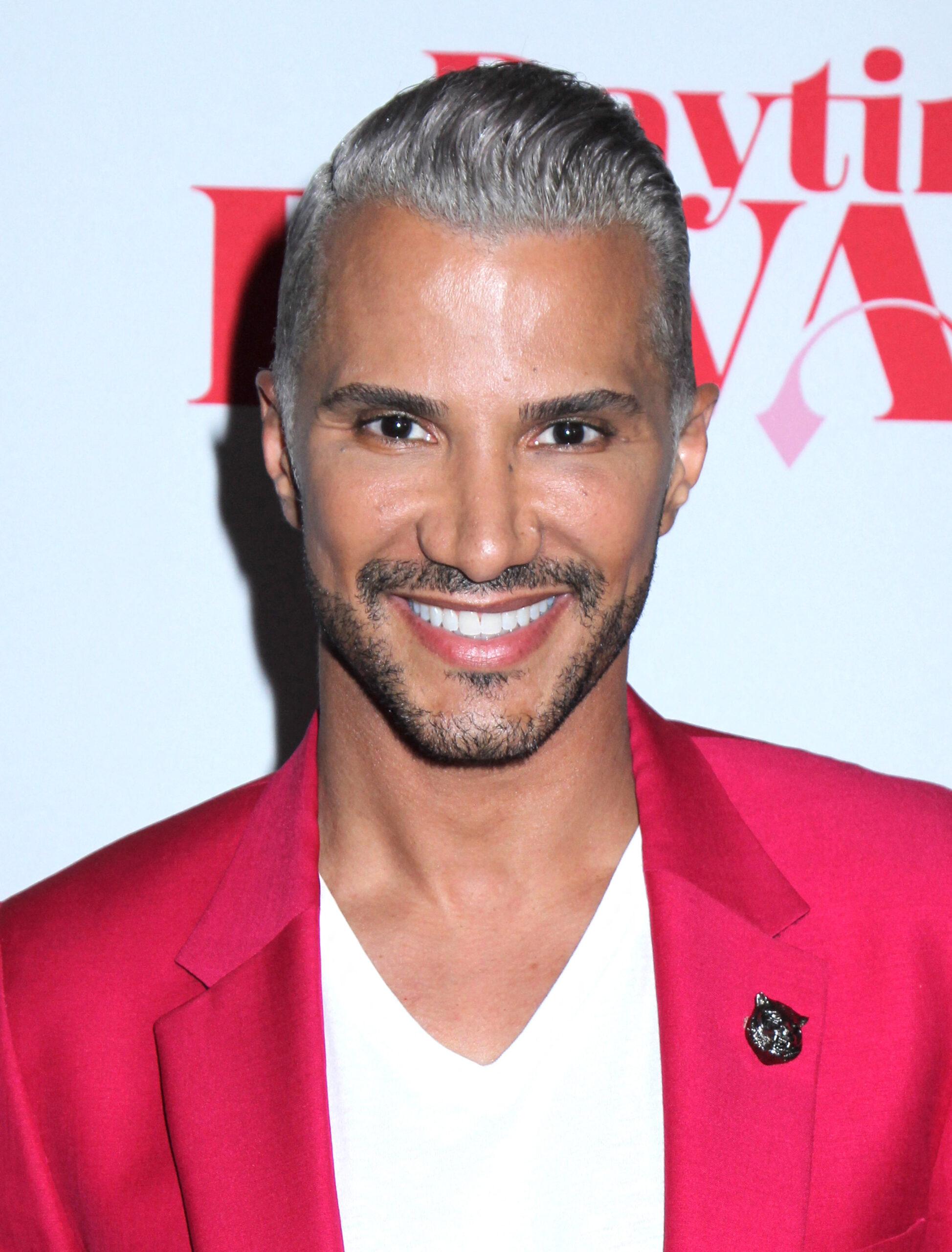 Jay Manuel posing on the red carpet. 