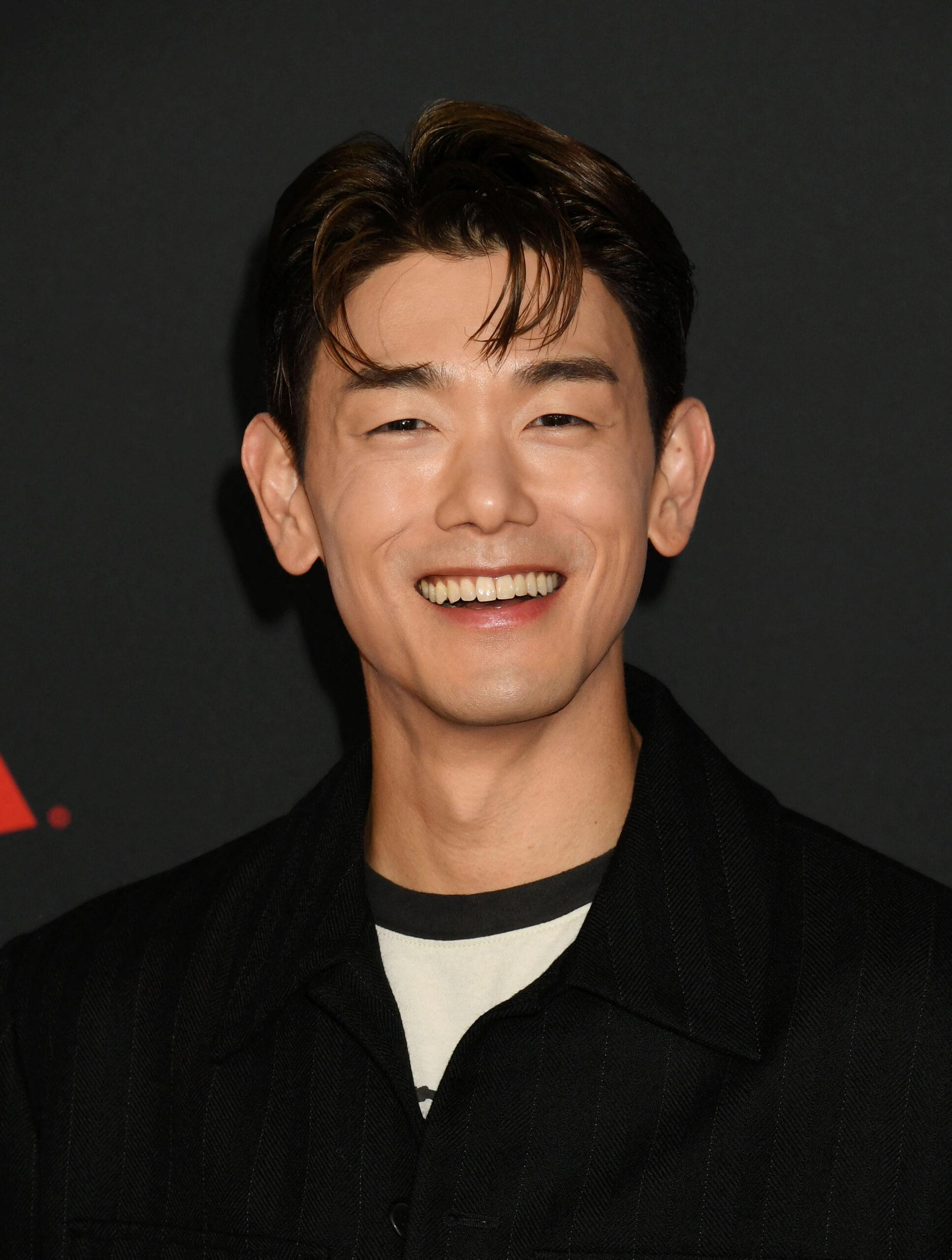 Eric Nam posing on the red carpet. 