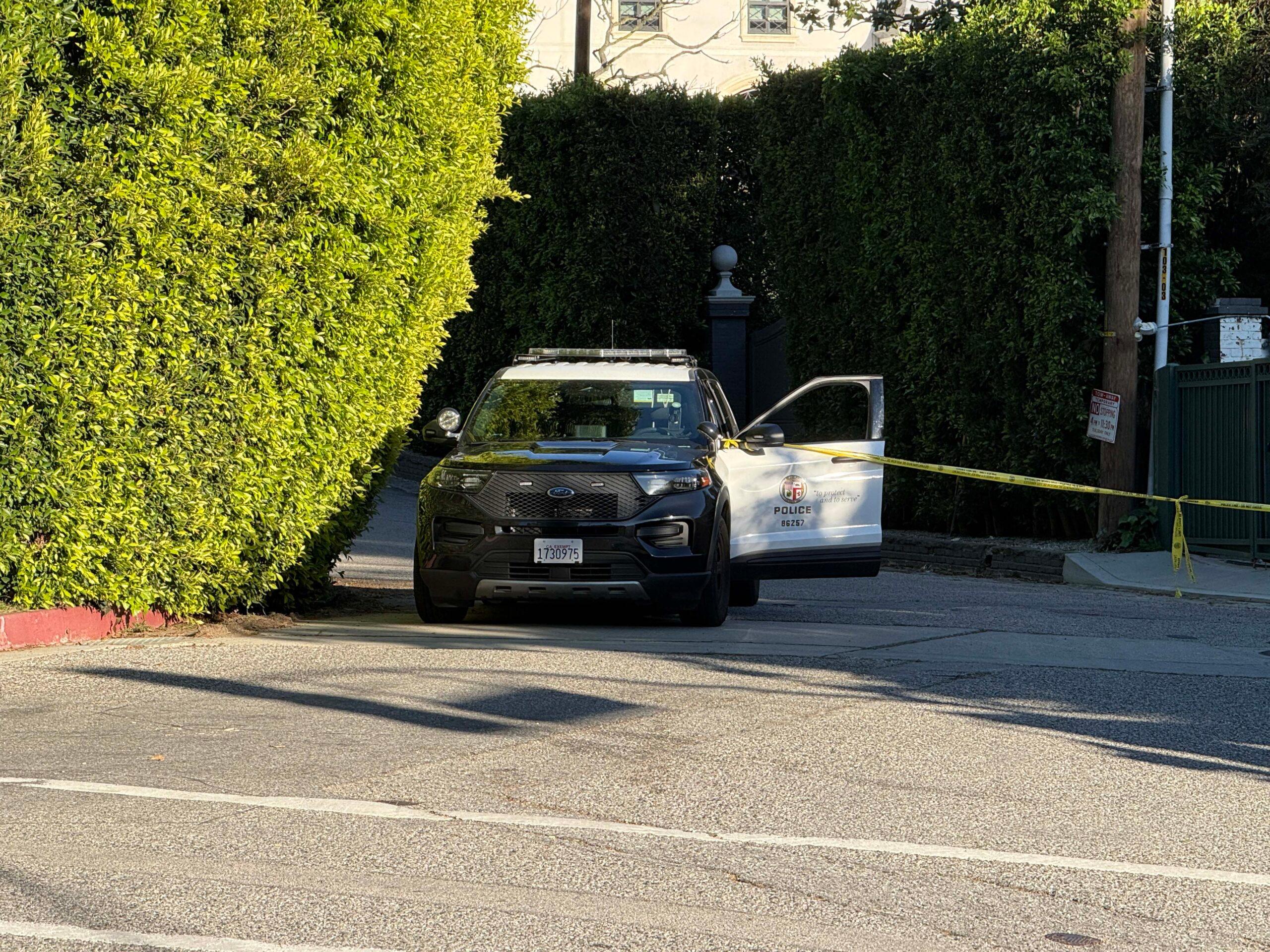 Police shut down the road outside of Rihanna's Beverly Crest home as it was struck by gunshots Sunday afternoon,