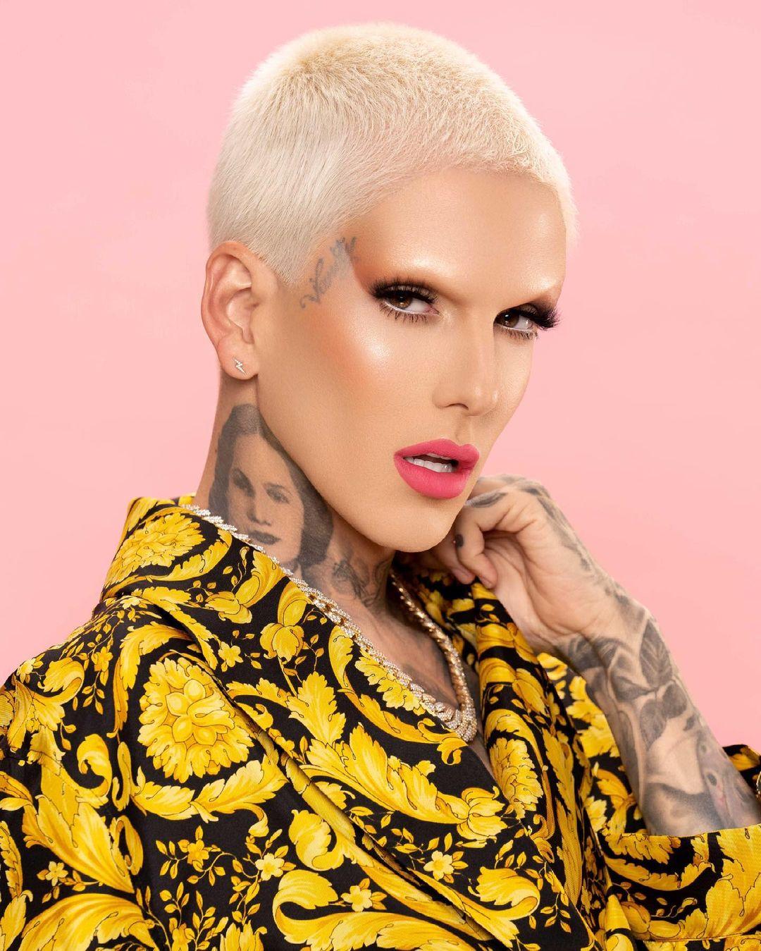 Jeffree Star in front of a pink backdrop