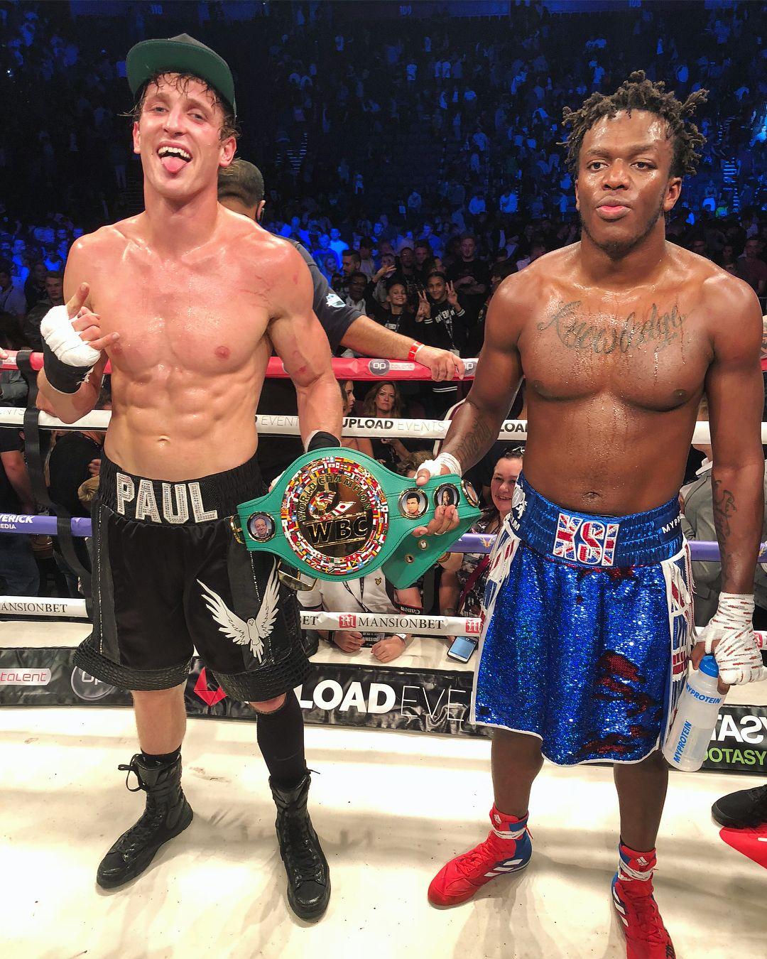 Logan Paul & KSI hold boxing match belt 