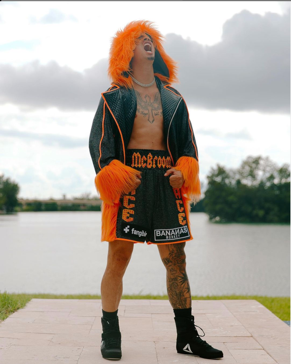 Austin McBroom in a boxing robe and shorts