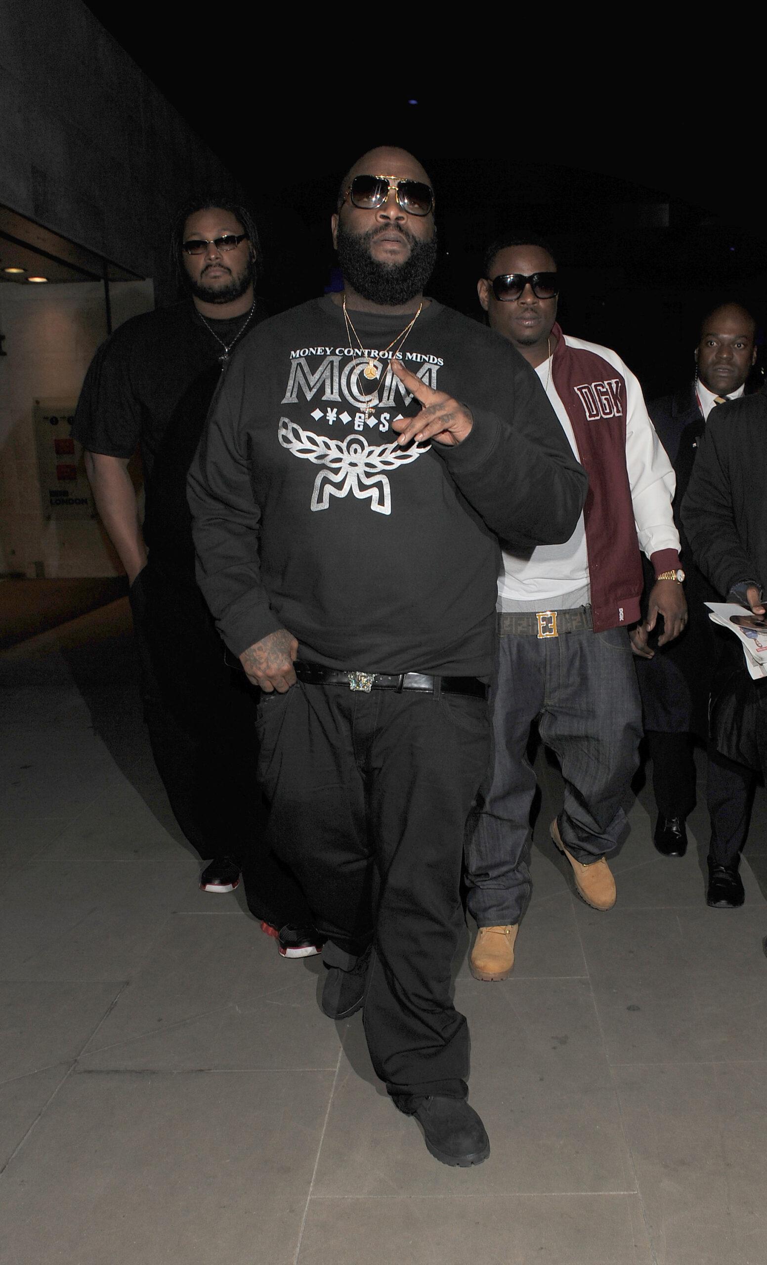 Rapper Rick Ross leaves the BBC Radio 1 studios wearing a sweatshirt with the slogan quot Money Controls Minds quot