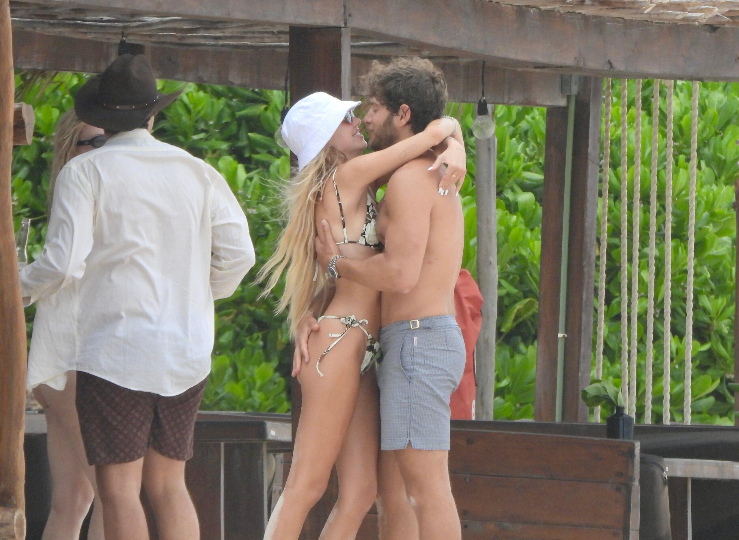 Delilah Hamlin kisses boyfriend Eyal Booker during a beach day in Mexico with her parents Lisa Rinna and Harry Hamlin