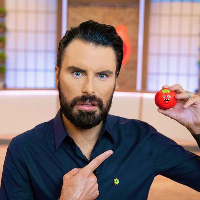 A photo showing Rylan Clark-Neal holding a fruit