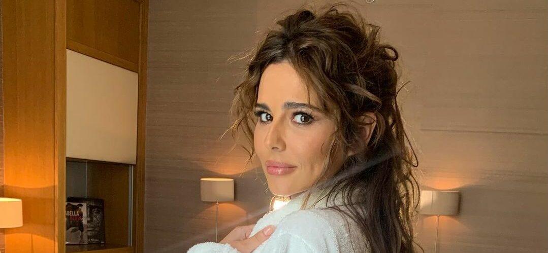 A photo showing Cheryl in a white robe.