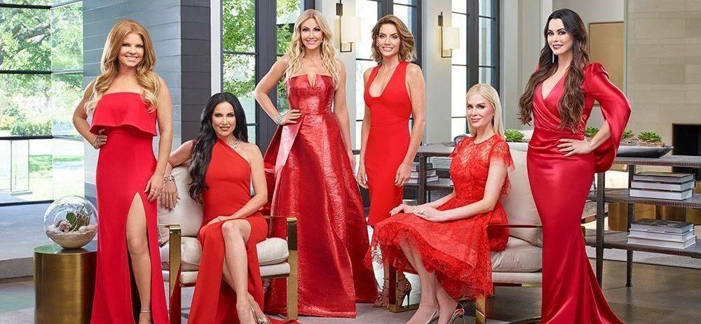 A photo showing the cast of 'Real Housewives of Dallas' in red dresses