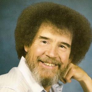 A photo showing Bob Ross with a huge smile on his face.