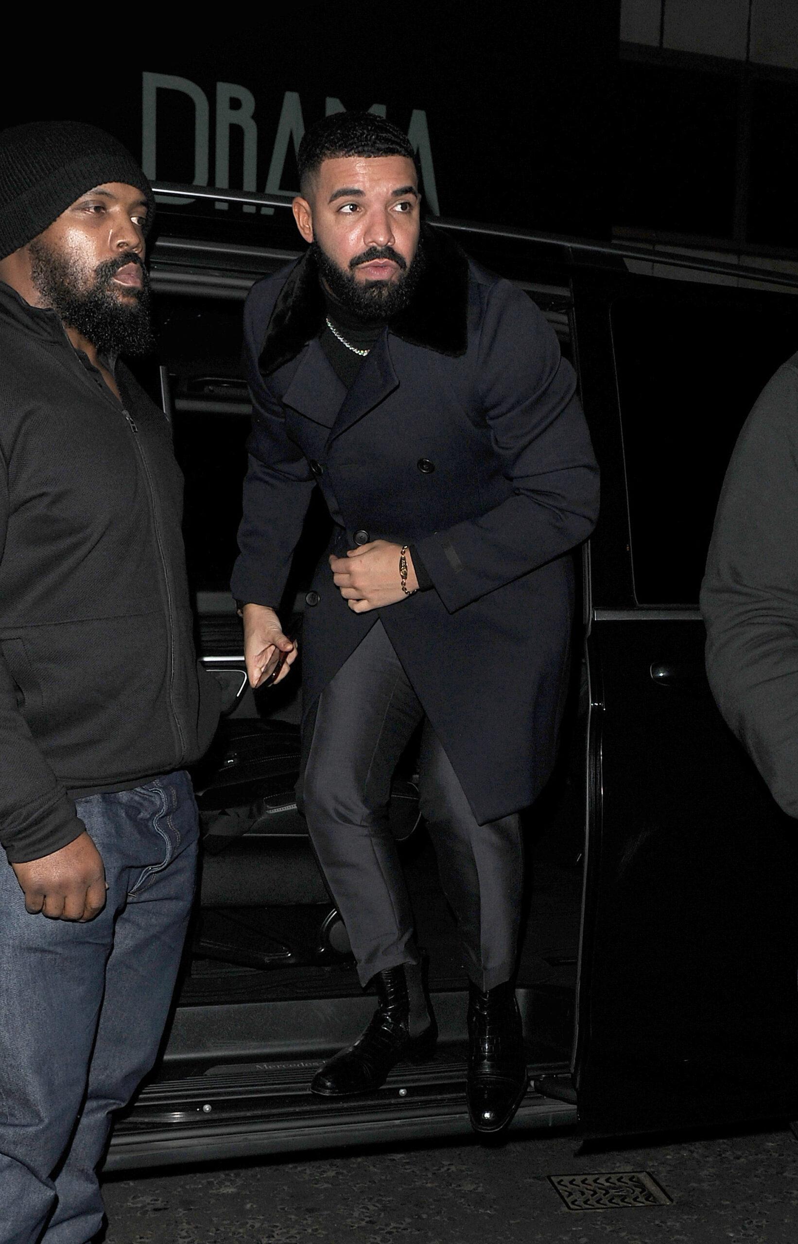 Drake seen arriving at The Colony Club Casino, flanked by minders..perhaps due to the recent spate of violent crimes being committed in the city