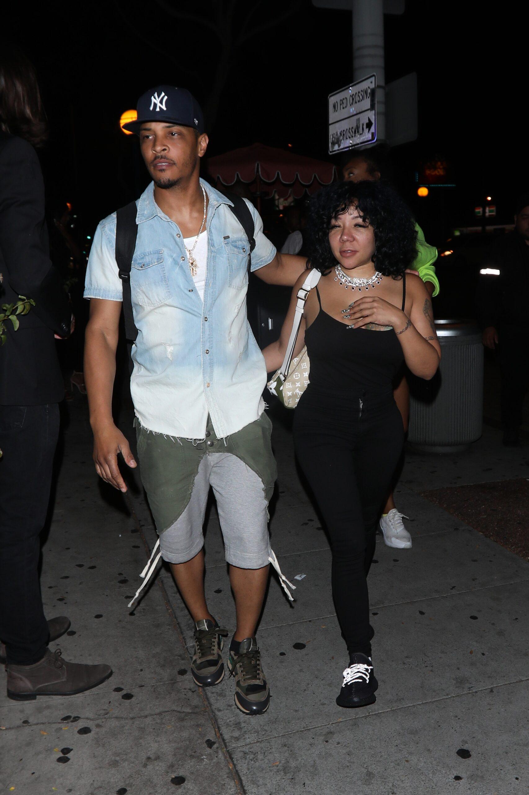 Rapper T.I. and wife Tiny are seen leaving the Delilah restaurant