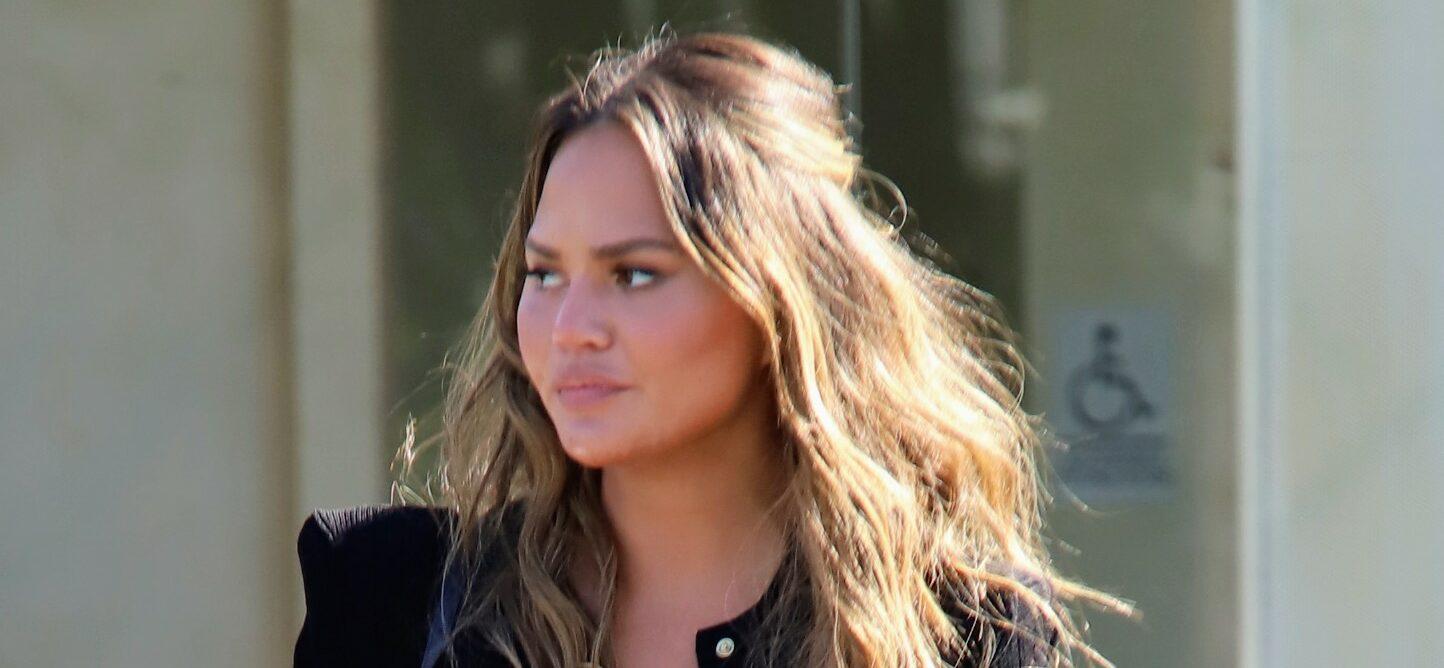 Chrissy Teigen in an all black outfit