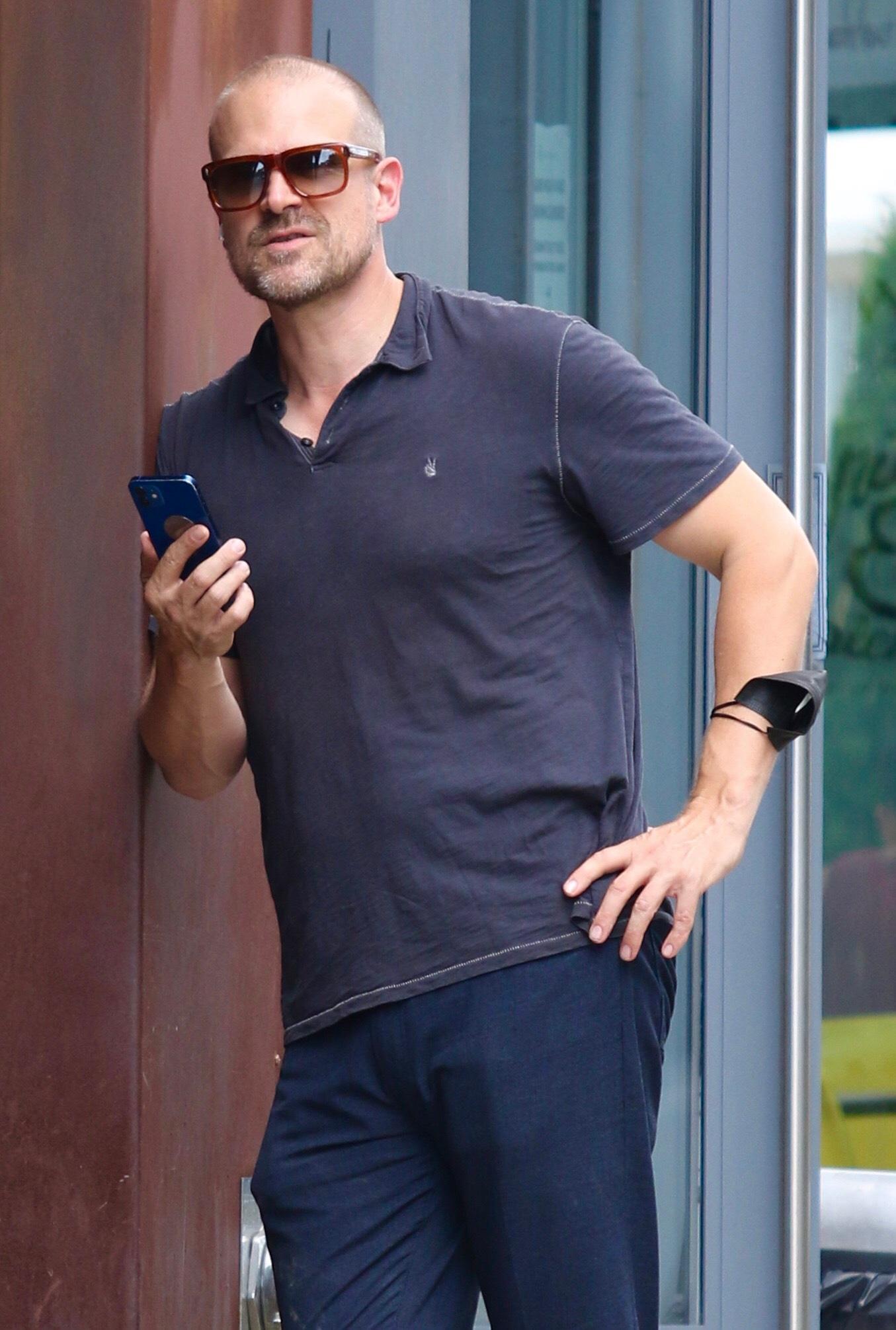 Stranger Things and Upcoming Black Widow star David Harbour looks busy on the phone after having lunch in NYC.