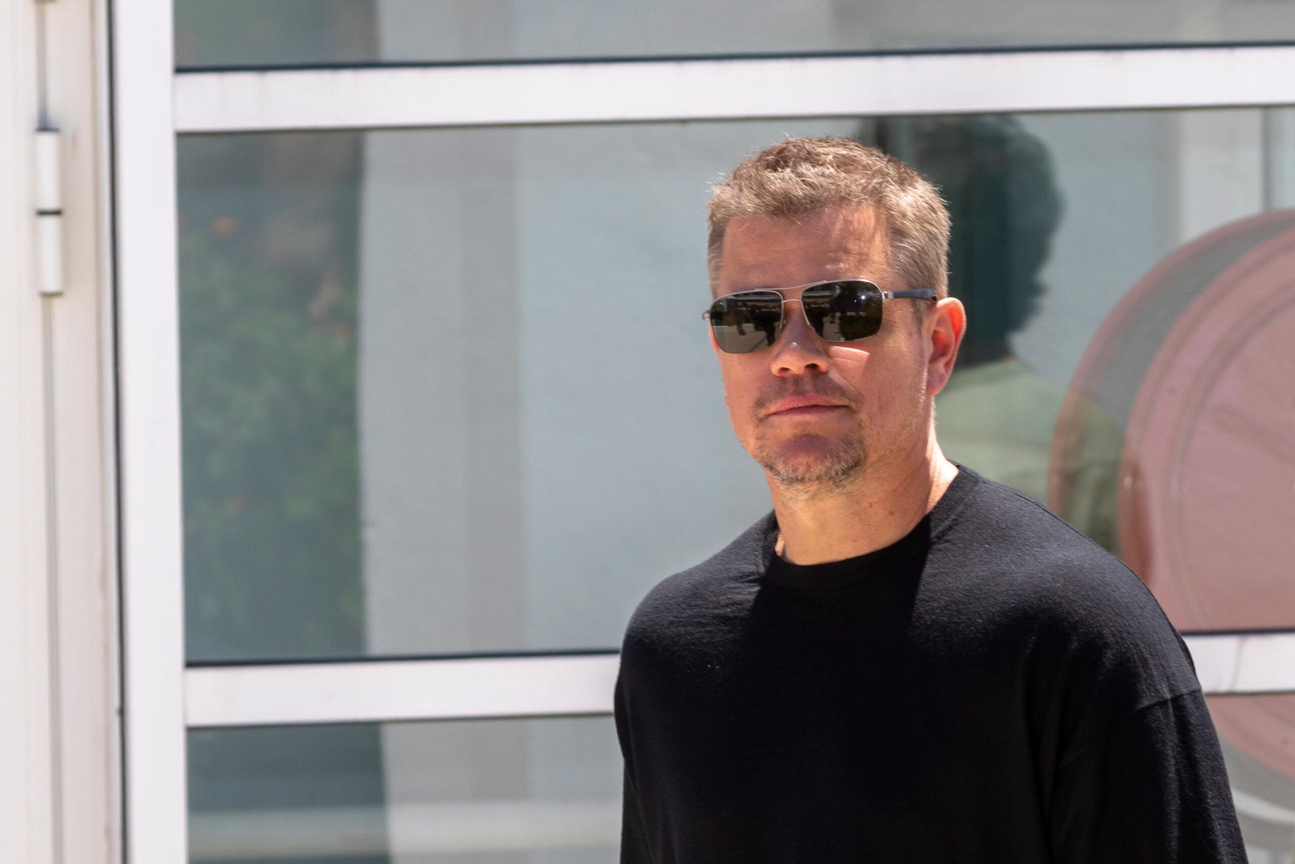 Matt Damon wearing sunglasses and a black shirt