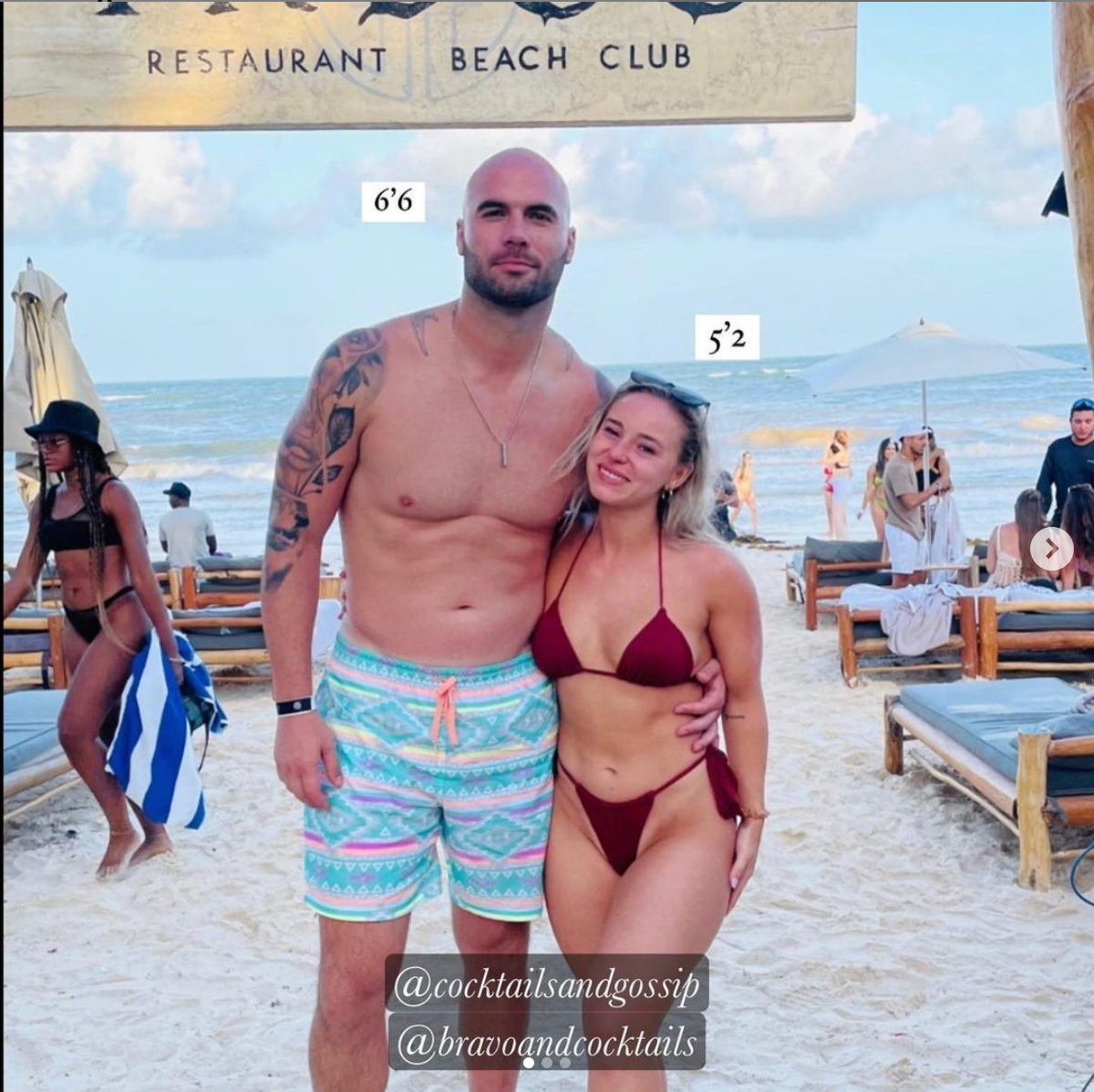 Mike Caussin with a mystery woman on the beach